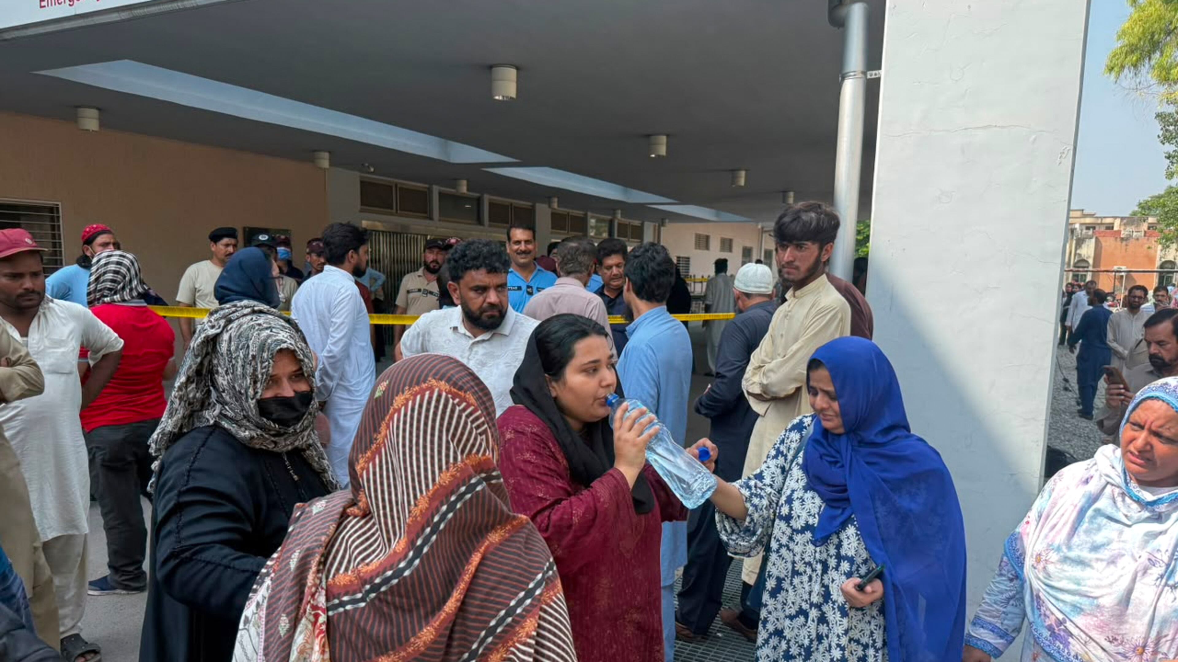 Relatives of the children who died in a hospital fire, gather at the hospital, in Islamabad, Pakistan, Wednesday, Aug. 26, 2026. (AP Photo/M.Yousaf)