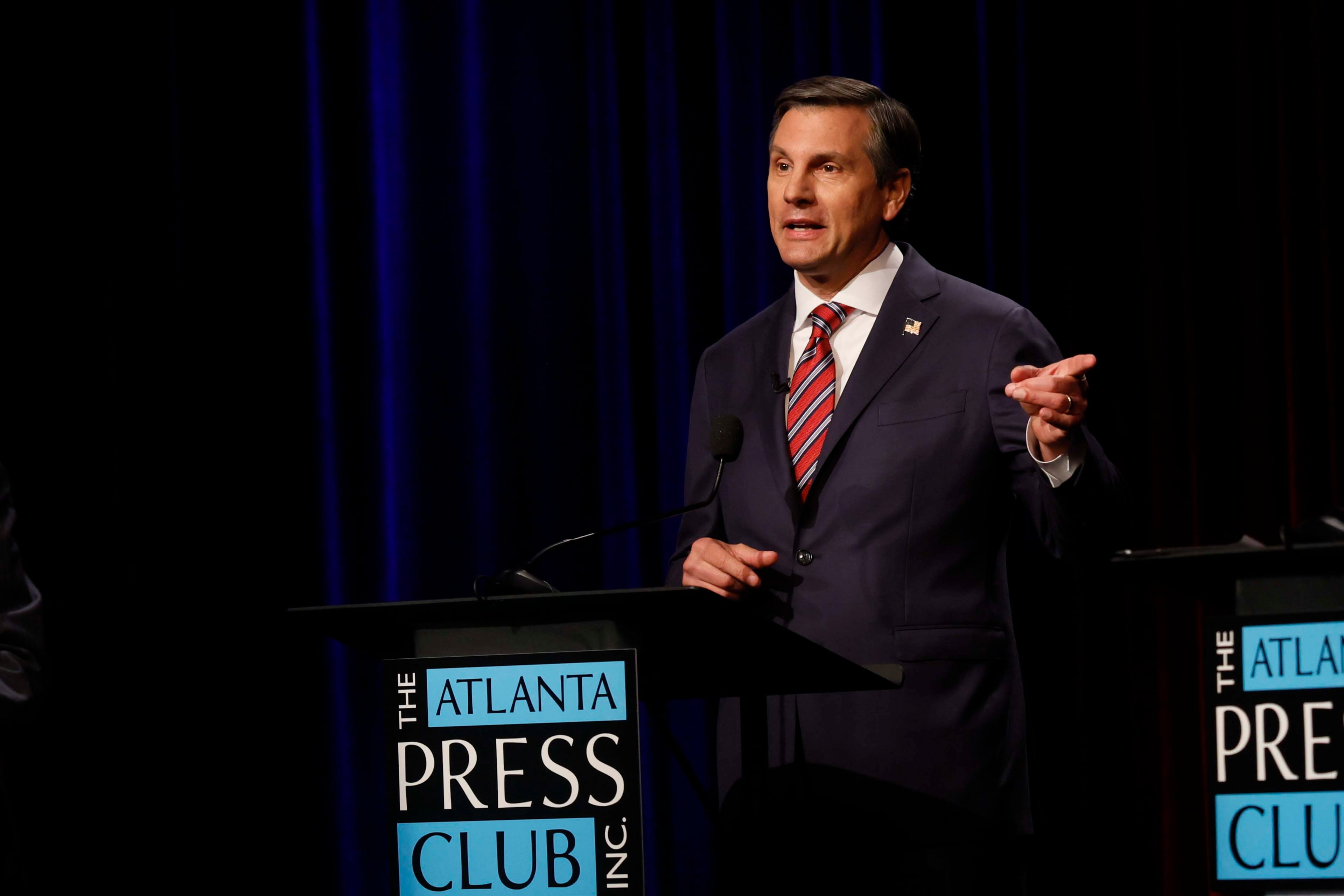 Former football coach Derek Dooley a Republican candidate for the U.S. Senate responds to a question at the Atlanta Press Club Loudermilk-Young debate for the U.S. Senate at Georgia Public Broadcasting in Midtown on Sunday, April 26, 2026. (Miguel Martinez/AJC)
