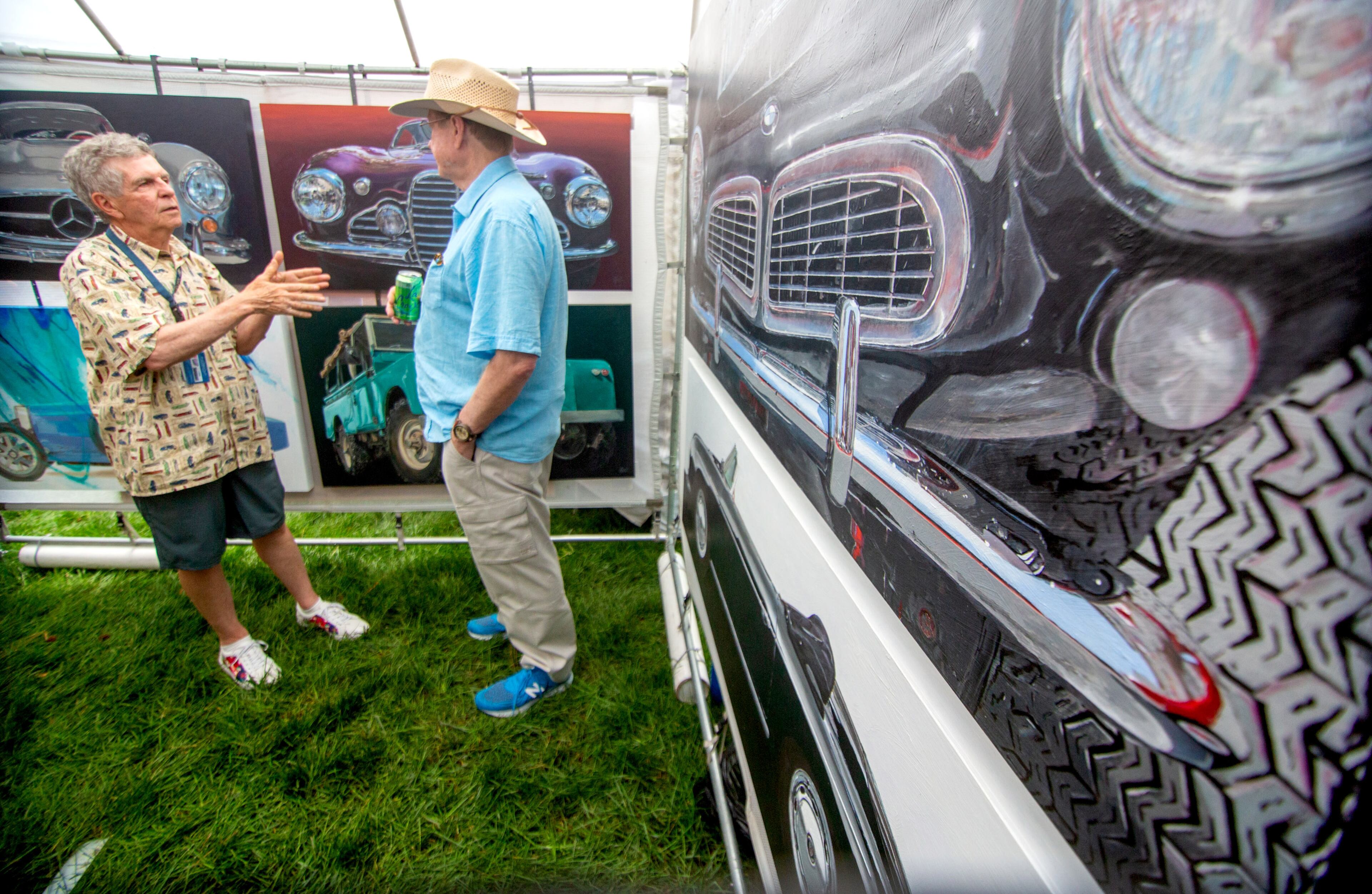 Richard Webb (left) talks with a customer in his artist tent during the Roswell Spring Arts and Crafts Festival on Sunday, June 13, 2021. (Photo: Steve Schaefer for The Atlanta Journal-Constitution)