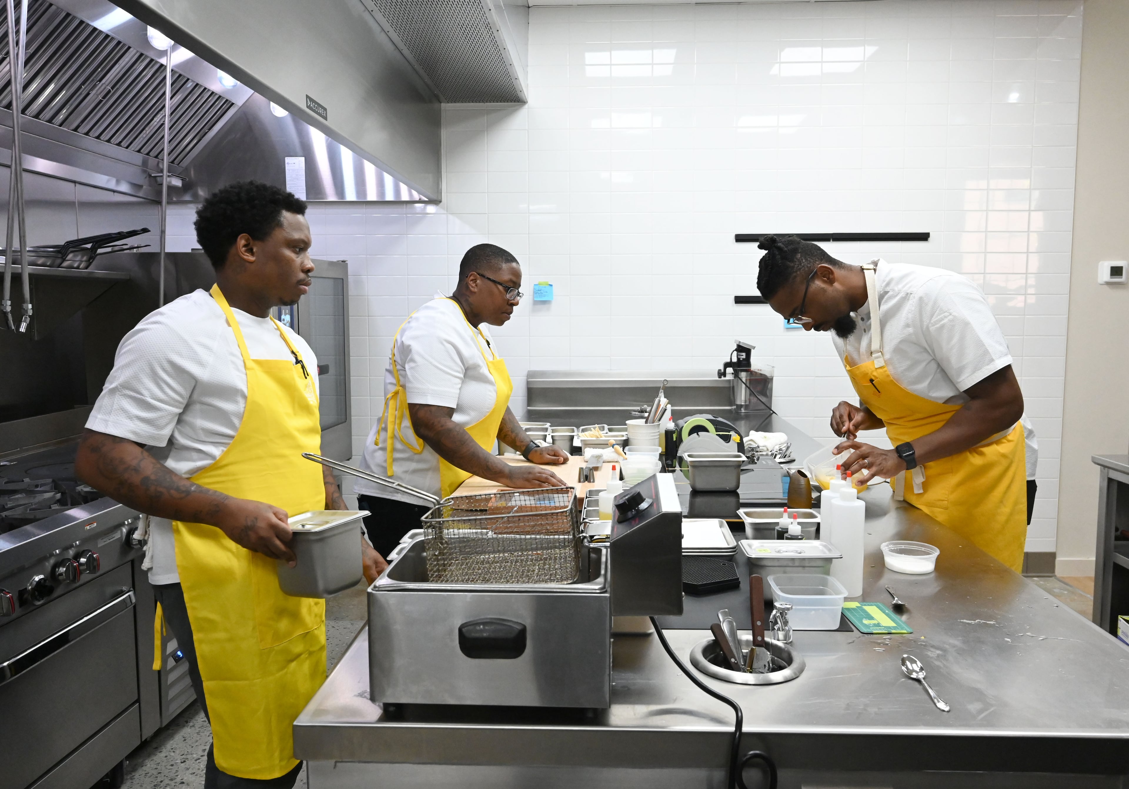 Chef Demetrius Brown, right, prepares Crudo from Haiti at Heritage Supper Club on Friday, Sept. 4, 2026, in Atlanta. Heritage, Brown’s highly anticipated new restaurant, is set to open Sept. 10. (Hyosub Shin/AJC)