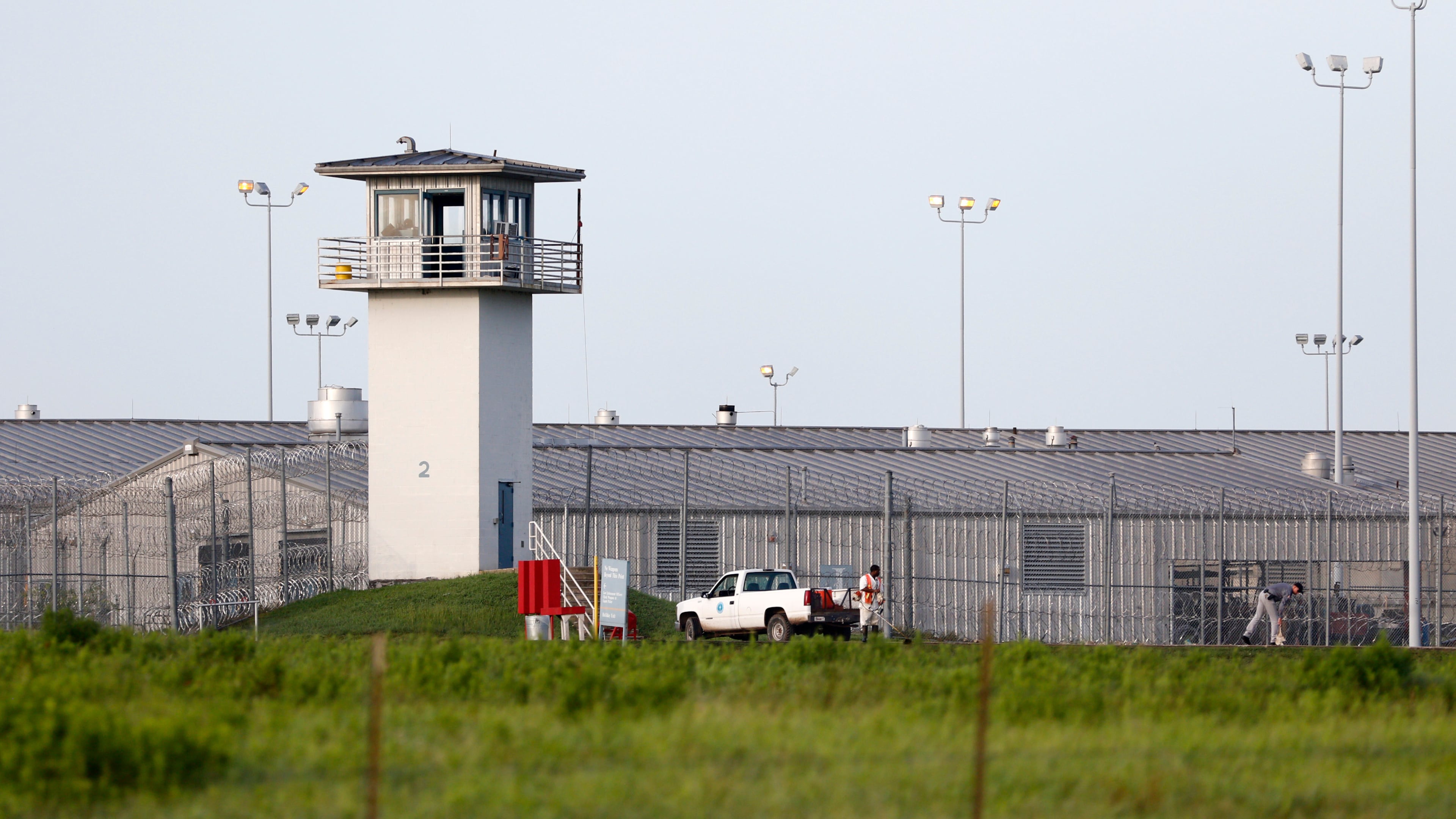 FILE - An inmate works outdoors during a hot summer day outside a Texas prison unit in Huntsville, Texas, on June 25, 2015. (Rose Baca/The Dallas Morning News via AP, File)