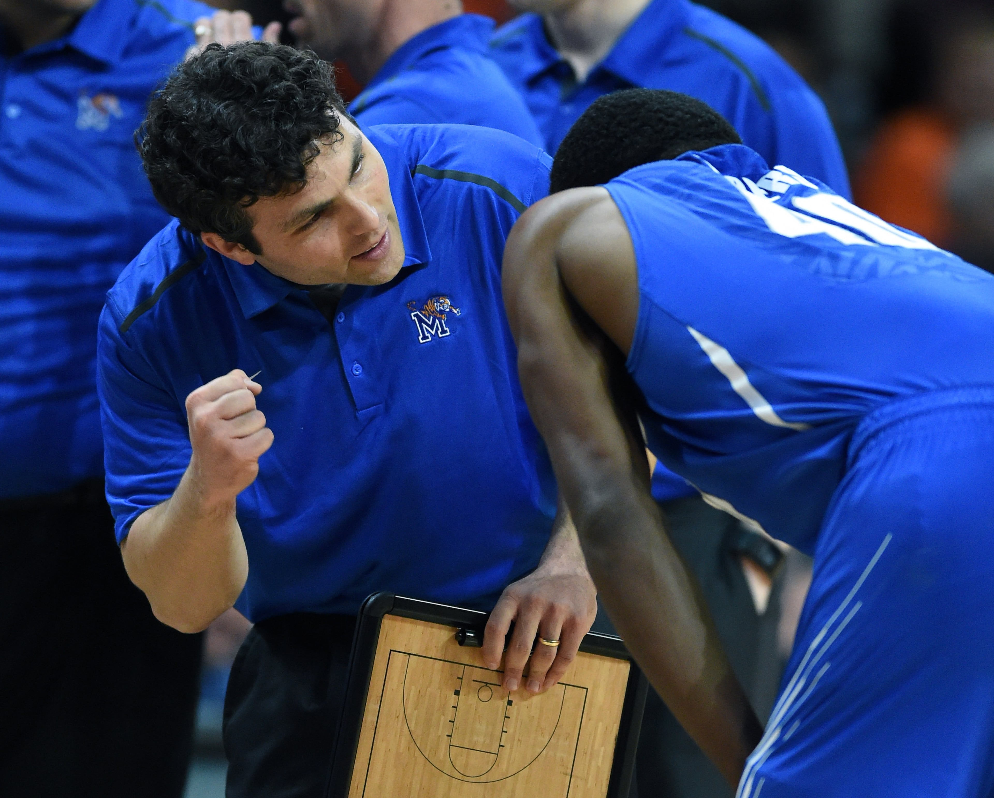 Coach Josh Pastner of the Memphis Tigers talks with player Calvin Godfrey. (Photo by Ethan Miller/Getty Images)