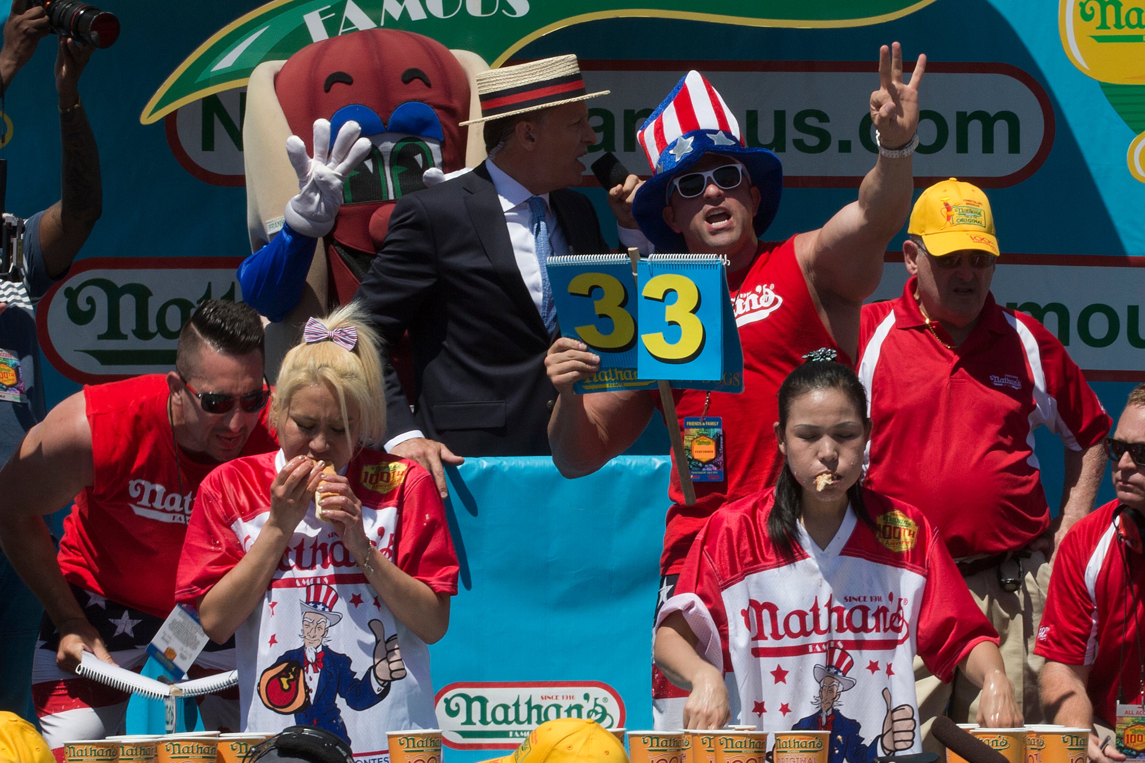 Miki Sudo, left, and Sonya Thomas compete in Nathan's Famous Fourth of July International Hot Dog Eating Contest Woman's competition, Monday, July 4, 2016, in New York. Sudo came in first and Thomas came in second. (AP Photo/Mary Altaffer)