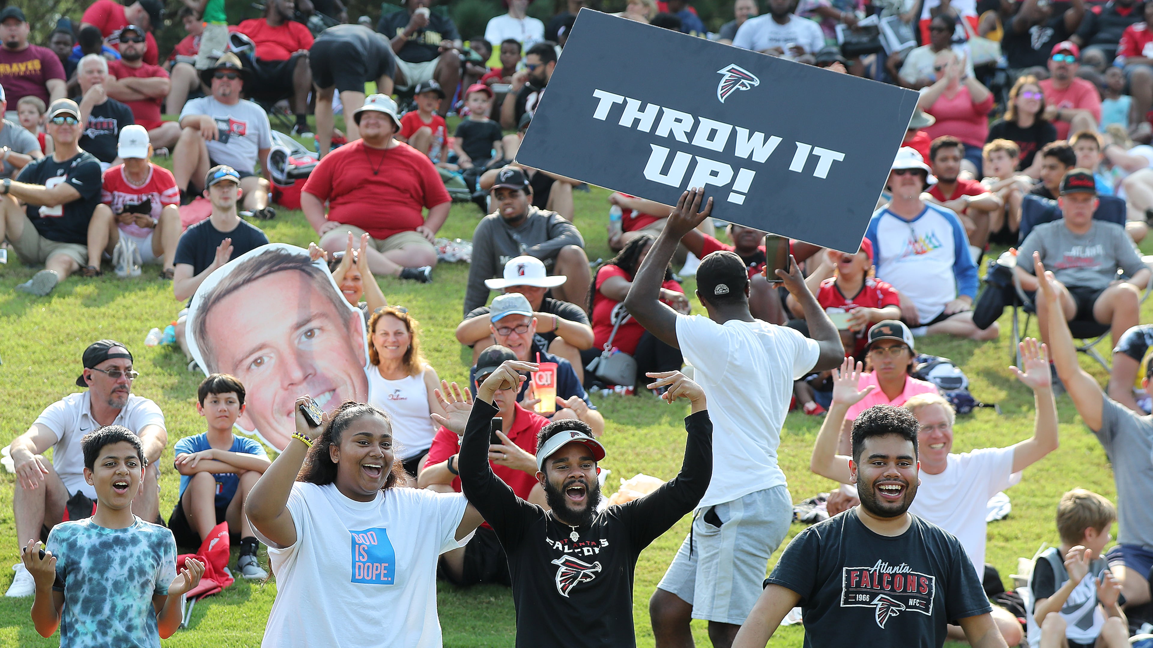 Atlanta Falcons fans cheer their team at training camp practice on Saturday, July 31, 2021, in Flowery Branch. (Curtis Compton/AJC)