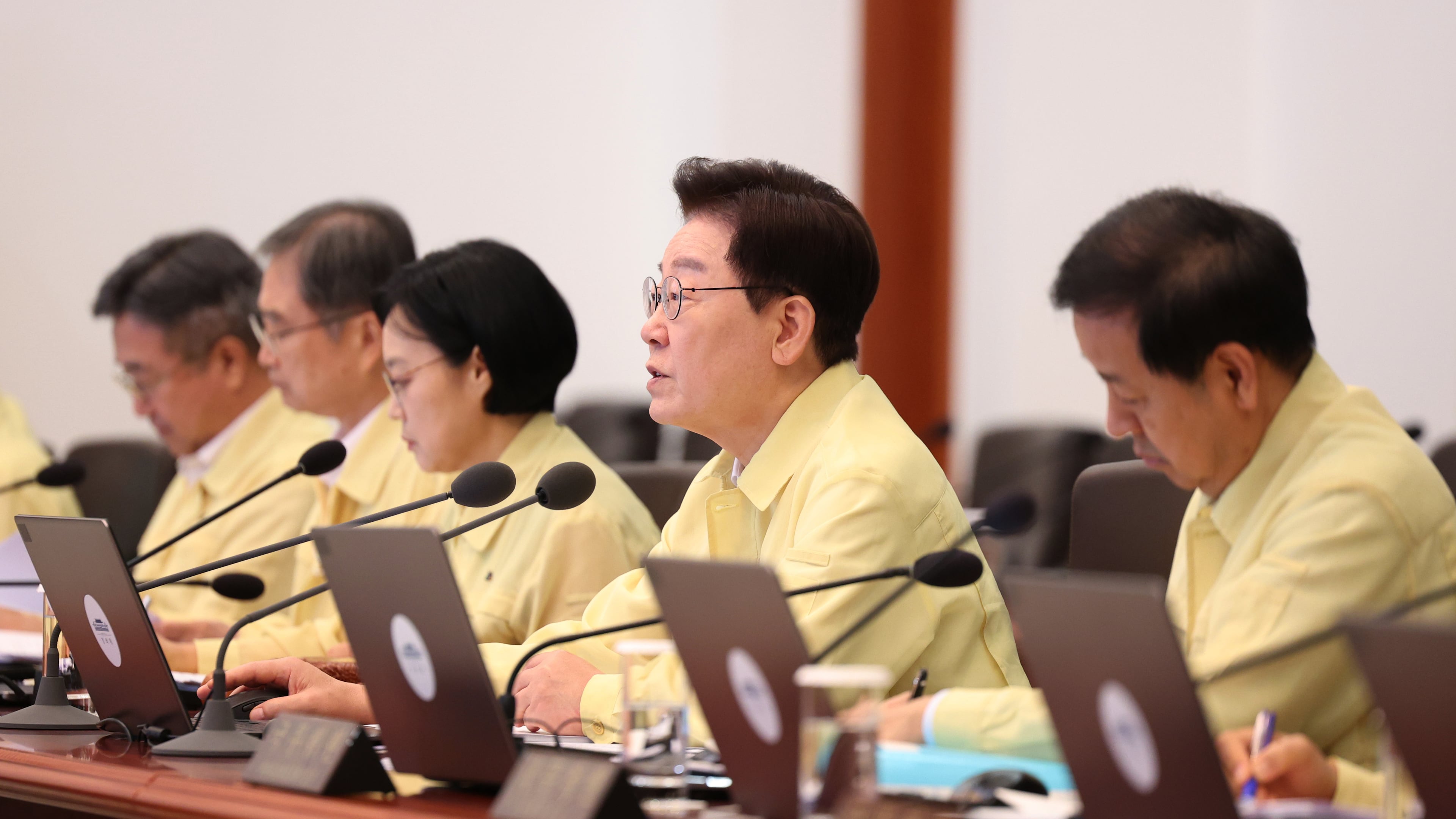 South Korean President Lee Jae-myung, second from right, speaks during a cabinet meeting at the presidential office in Seoul, South Korea, Tuesday, Aug. 18, 2026. (Yonhap via AP)