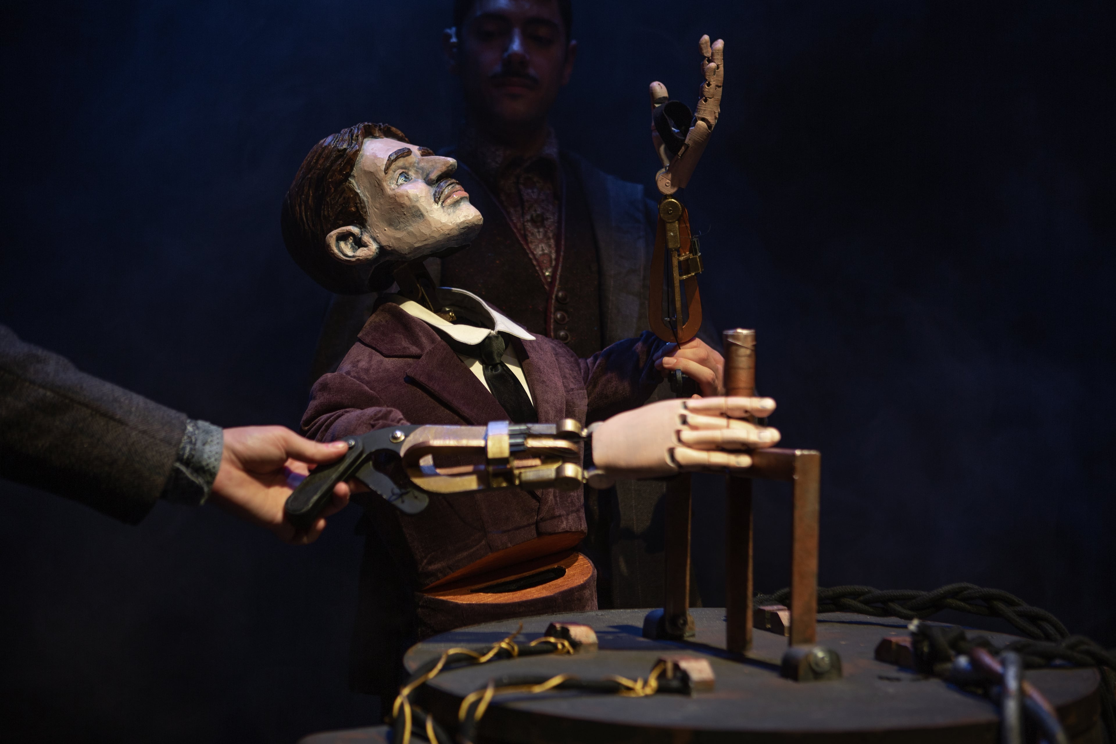 Tesla pulls the switch with all his power. (Photo courtesy of Center for Puppetry Arts/Stacey Bode)