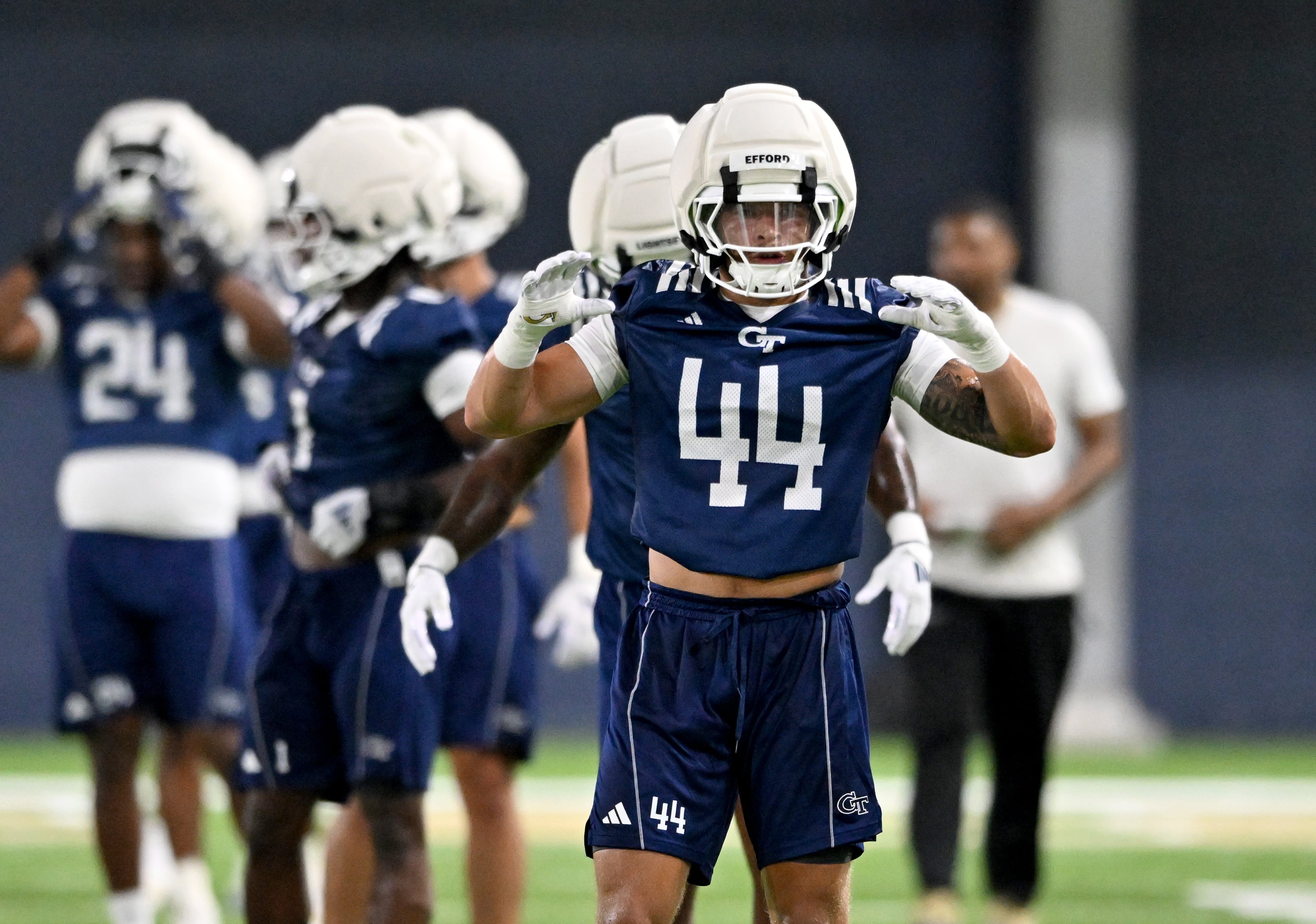 Georgia Tech linebacker Kyle Efford (44) warms up during the first day of football practice at Rose Bowl Field and the Mary and John Brock Football Practice Facility, Tuesday, July 29, 2025, in Atlanta. (Hyosub Shin / AJC)