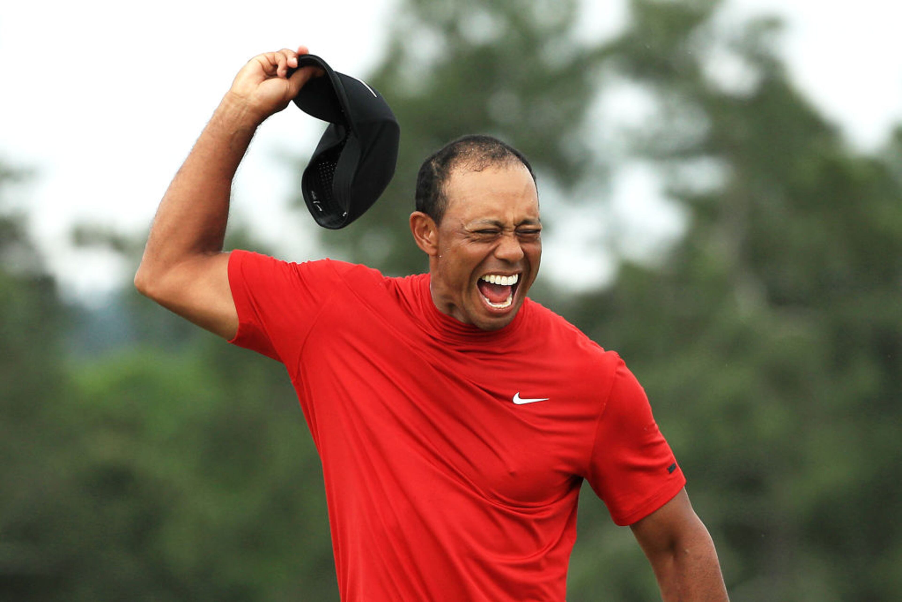 AUGUSTA, GEORGIA - APRIL 14: Tiger Woods of the United States celebrates after sinking his putt on the 18th green to win during the final round of the Masters at Augusta National Golf Club on April 14, 2019 in Augusta, Georgia. (Photo by Mike Ehrmann/Getty Images)