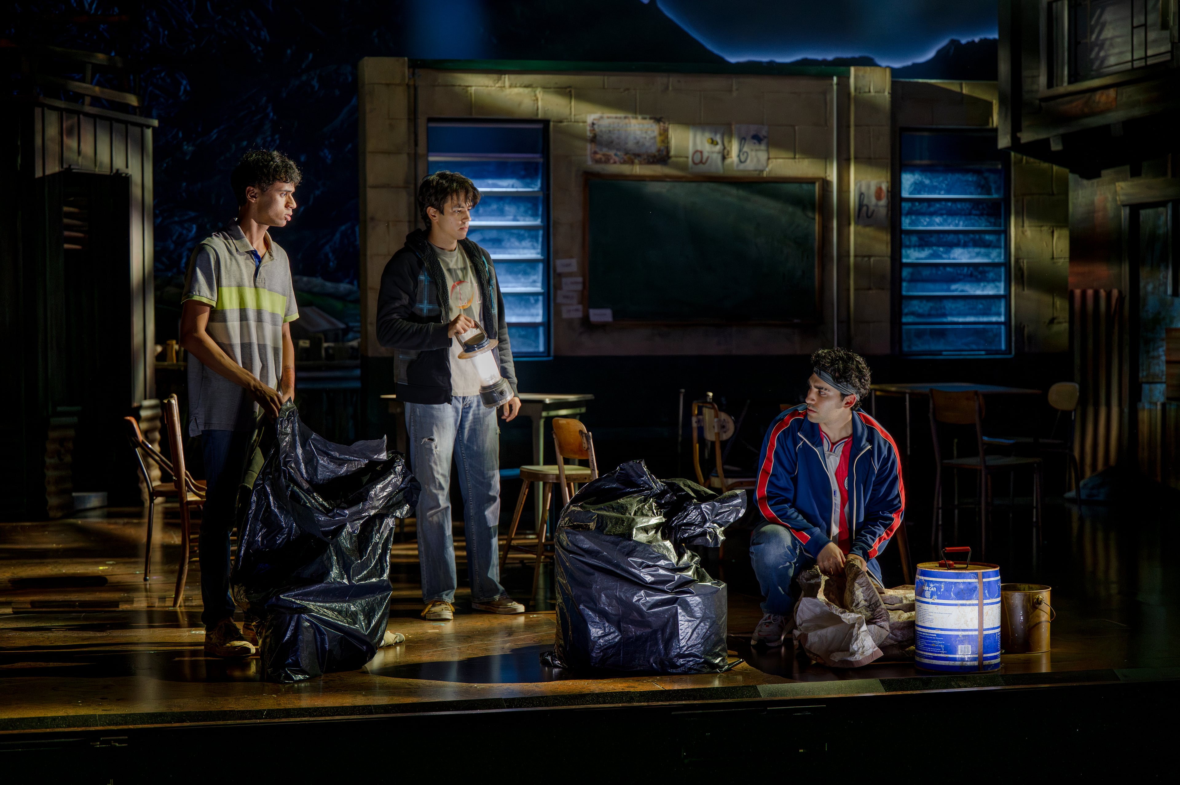 Nathan Diaz, Zack Calderon and Dario Alvarez portray some of the orchestra members in "Basura." (Greg Mooney/Courtesy of Alliance Theatre)