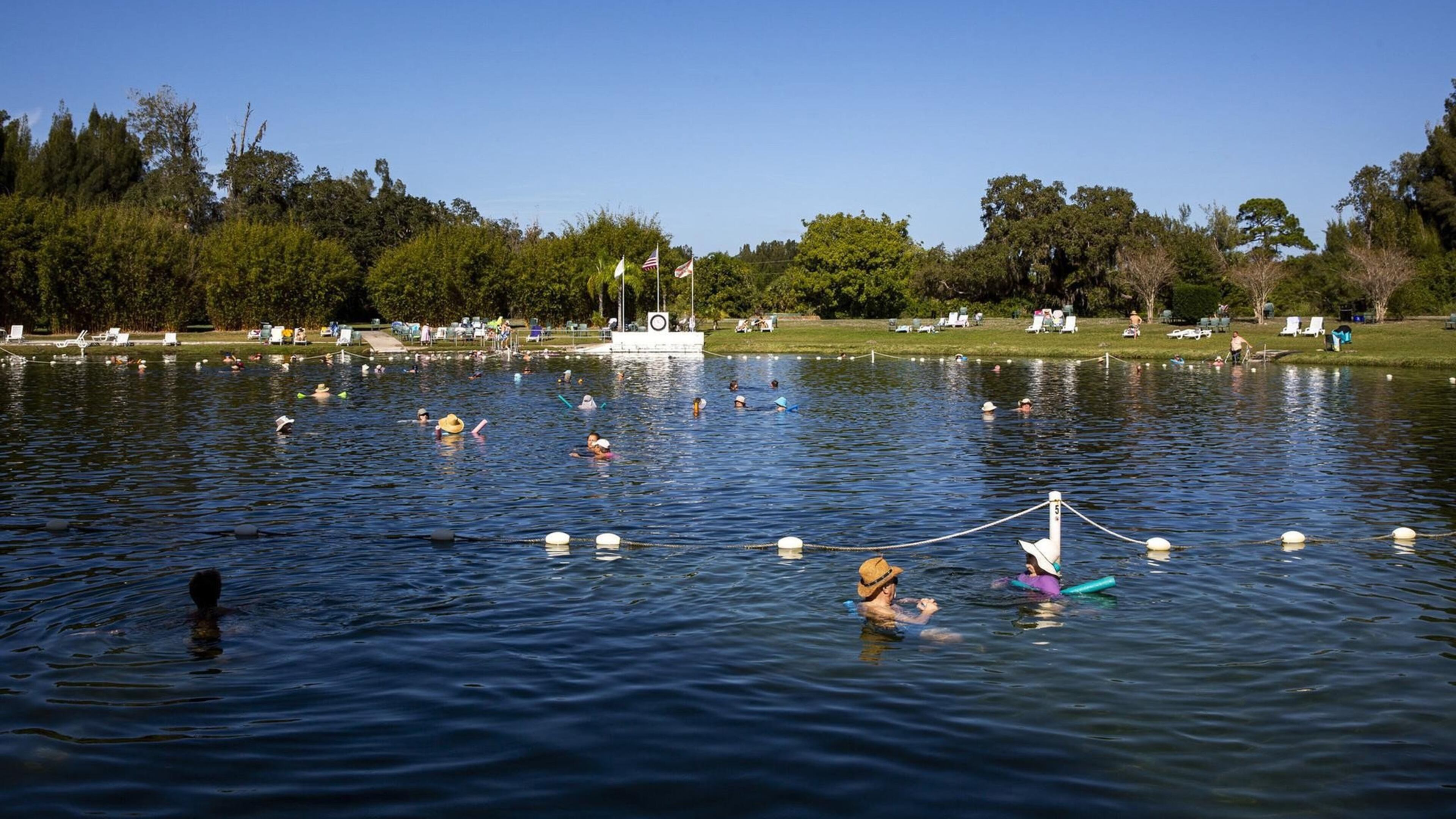 Swimmers wade in the mineral-rich waters at Warm Mineral Springs in North Port. PATRICK CONNOLLY/ORLANDO SENTINEL/TNS