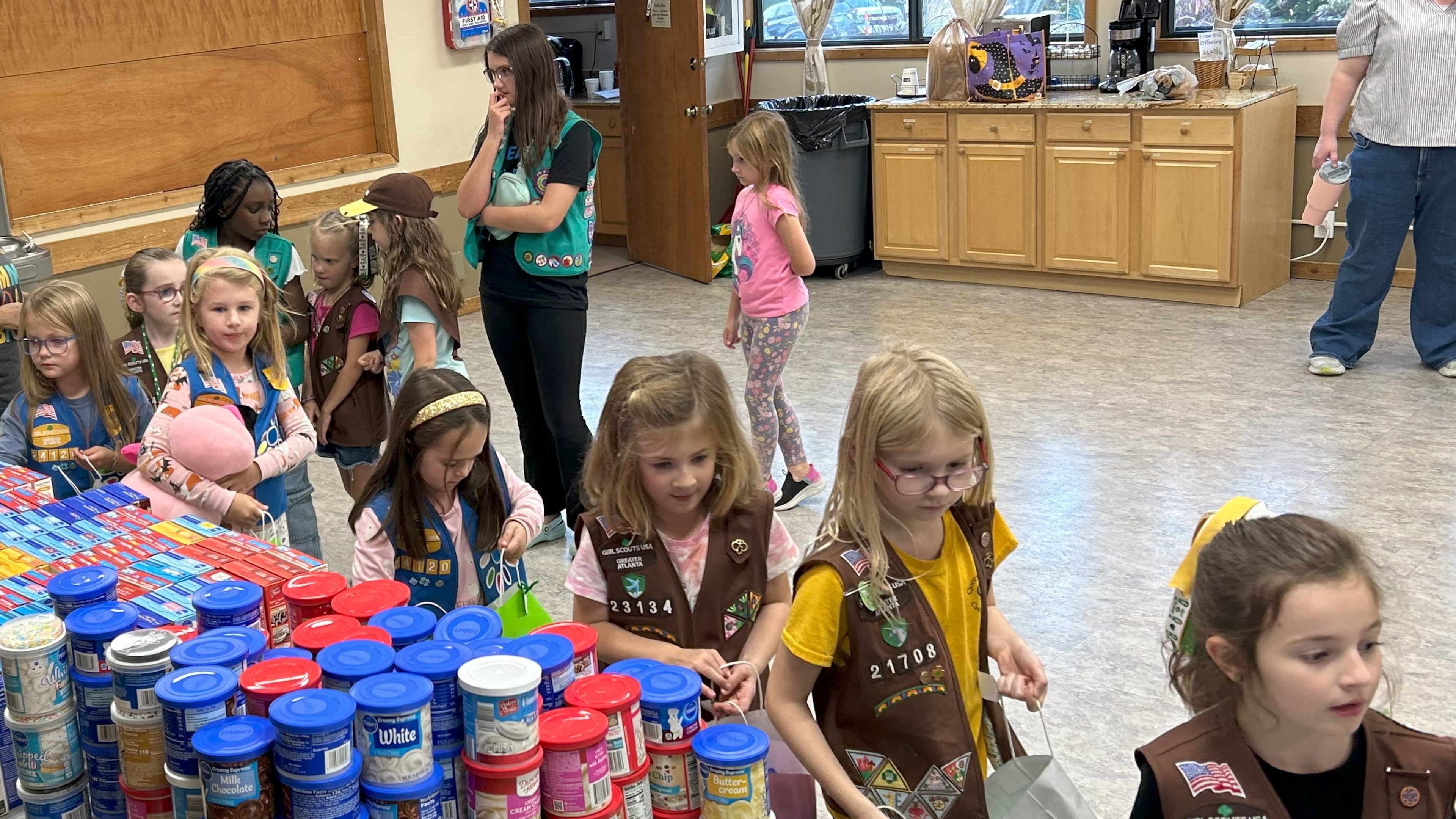 Girl Scout Brownie troops assemble almost 250 birthday bags with frosting and cake mixes to donate to food pantries and other nonprofits. Scouts learned that some children don't get cake on their birthday because of food insecurity. Courtesy of Girl Scout Troop 23134