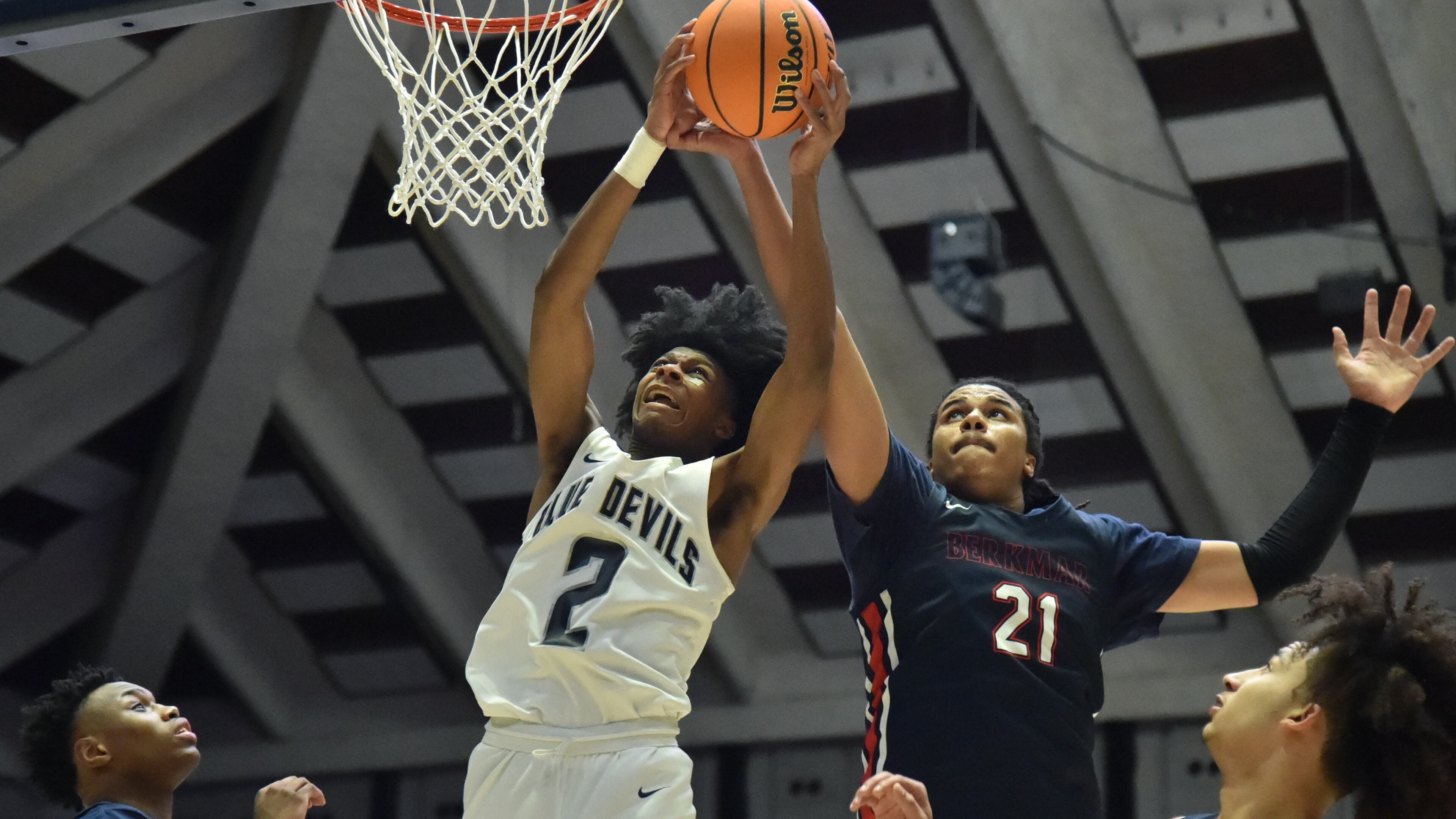 March 12, 2022 Macon - Norcross' London Johnson (2) and Berkmar's Malique Ewin (21) fight for a rebound during the 2022 GHSA State Basketball Class AAAAAAA Boys Championship game at the Macon Centreplex in Macon on Saturday, March 12, 2022. (Hyosub Shin / Hyosub.Shin@ajc.com)
