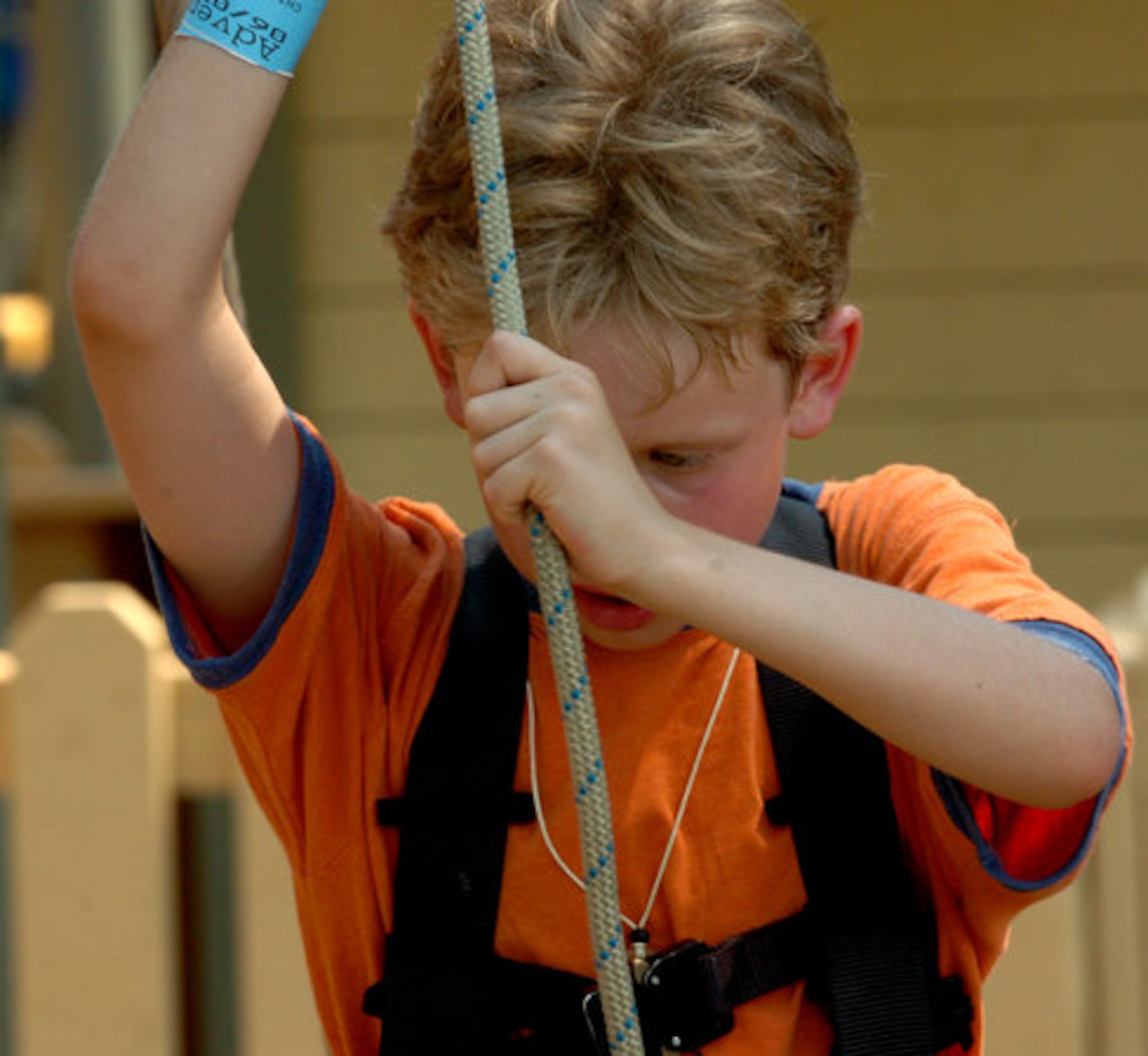 River Ross, 8, of Milton focuses on the rope he is about to walk across. Park workers posted throughout the course offer everything from a little advice to a ride for kids who freeze and just can't do it. Luckily, Ross didn't need their help.
