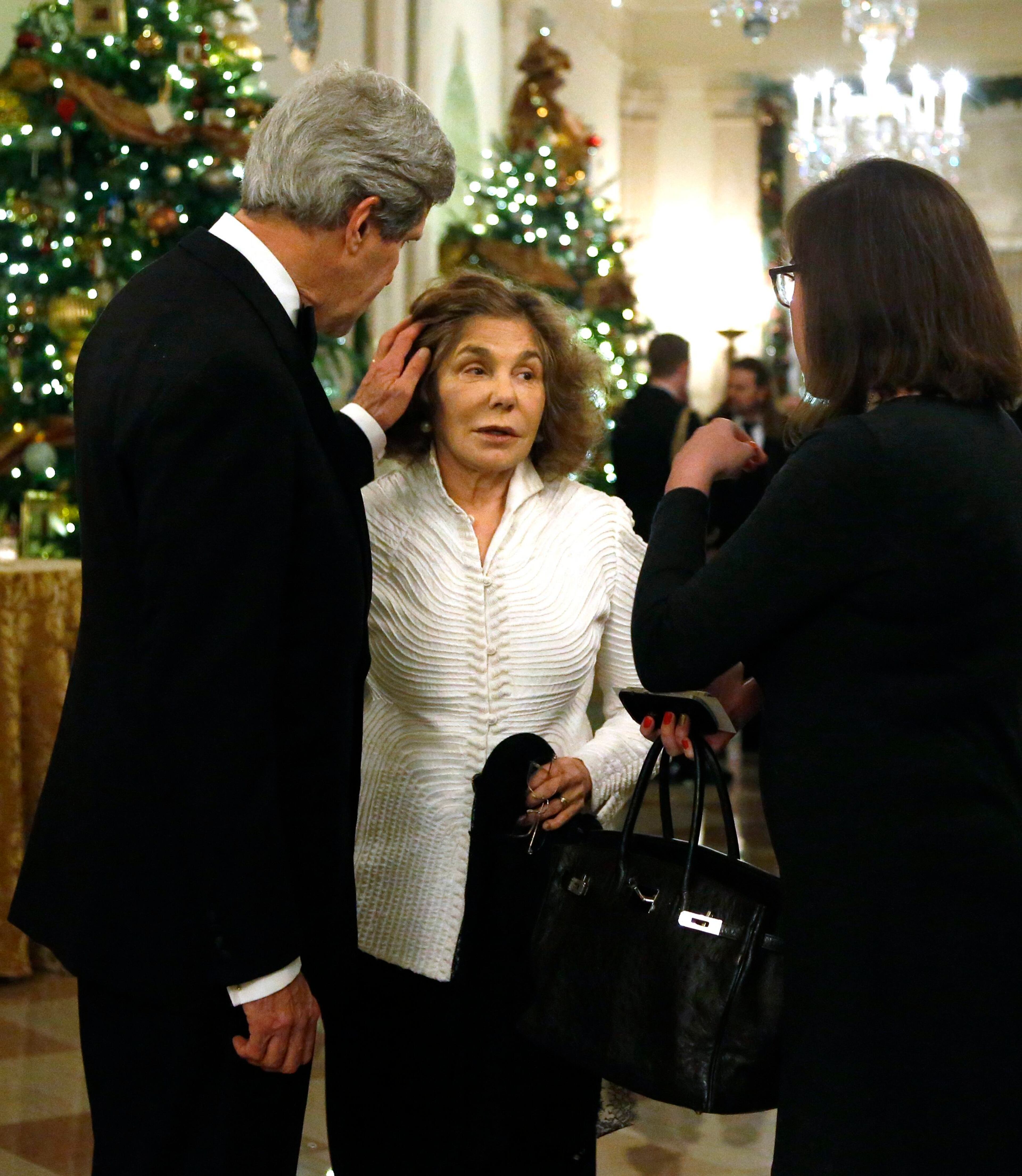 U.S. Secretary of State John Kerry (L) and his wife Teresa Heinz Kerry (C) arrive for a reception for the 2013 Kennedy Center Honors recipients at the White House in Washington, December 8, 2013. Musicians Herbie Hancock, Billy Joel and Carlos Santana, as well as opera singer Martina Arroyo and actress Shirley MacLaine are being honored this year for their lifetime contributions to American culture through the performing arts.