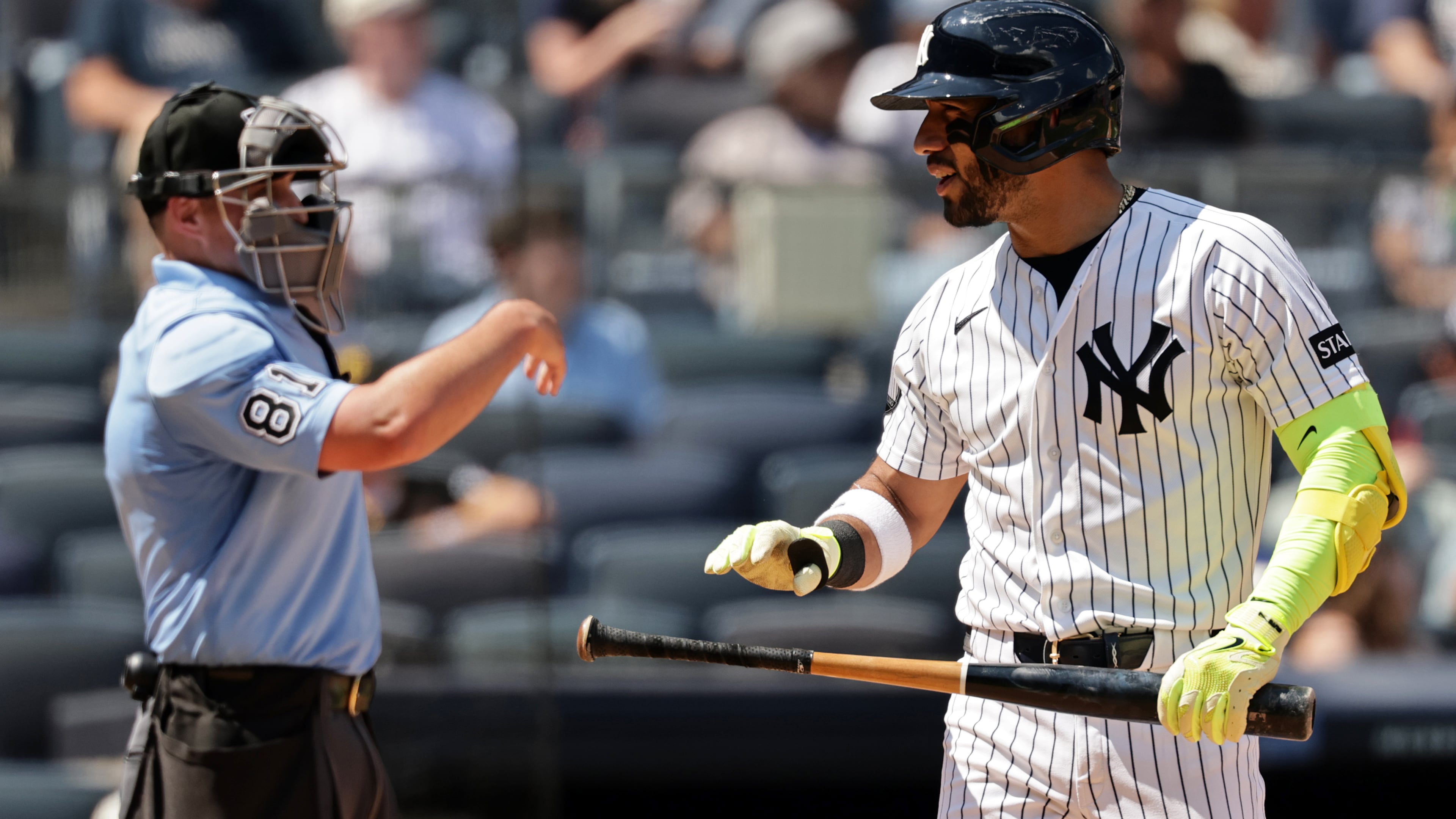 New York Yankees' José Caballero reacts after striking out in front of home plate umpire Quinn Wolcott (81) in the sixth inning during the first baseball game of a doubleheader against the Pittsburgh Pirates, Wednesday, July 22, 2026, in New York. (AP Photo/Adam Hunger)