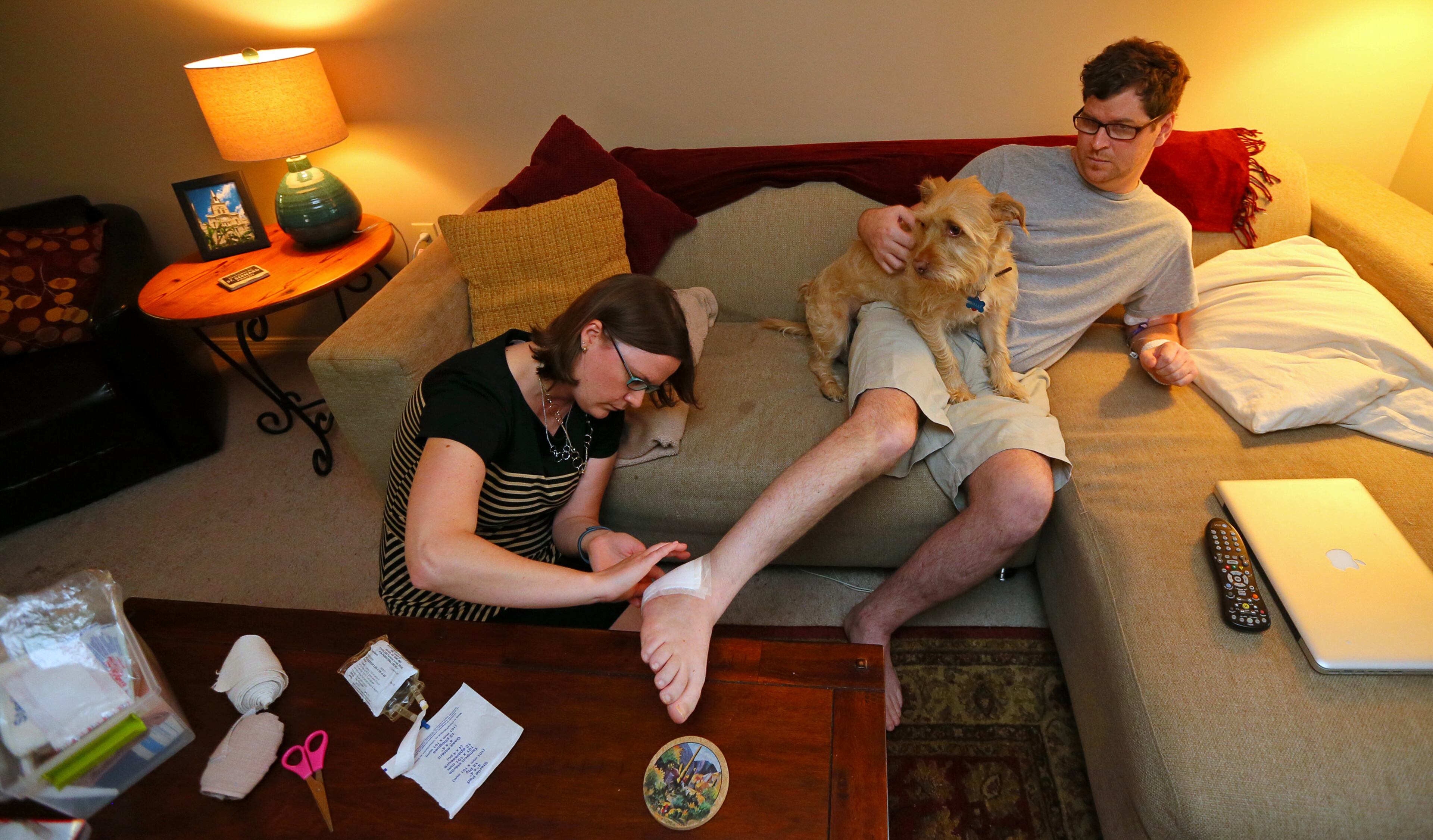 Misty became a caretaker to Jason and it starts to take it's toll on her. She changed the bandage on his foot every day for weeks after surgery in July to remove the infected tissue and bone from the staph infection. CURTIS COMPTON / CCOMPTON@AJC.COM