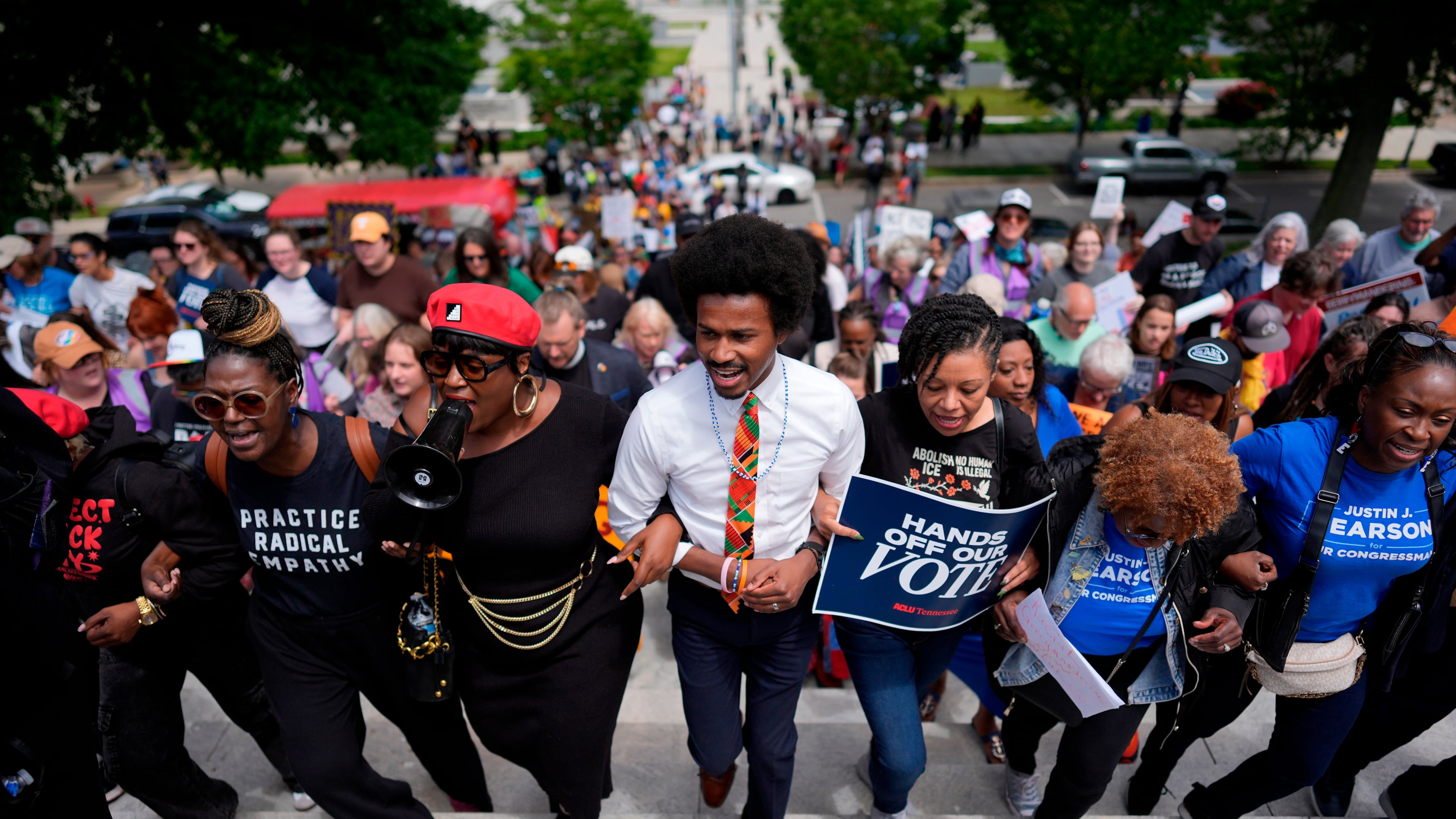 Rep. Justin J. Pearson, D-Memphis, center, marches with protesters before a special session of the state legislature to redraw U.S. Congressional voting maps, in Nashville, Tenn., Tuesday, May 5, 2026. (AP Photo/George Walker IV)