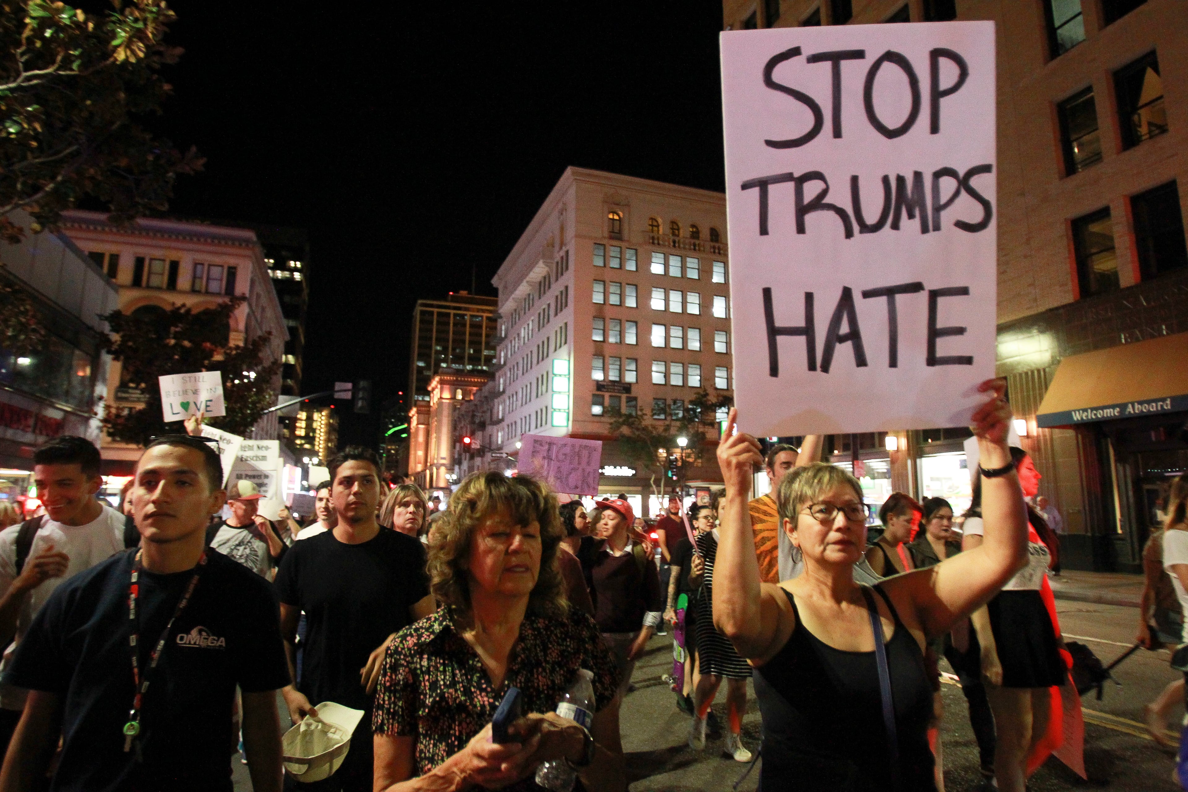 A crowd of around 300 people marches down Broadway on Nov. 9, 2016, in downtown San Diego, during a protest in opposition of Donald Trump's presidential election victory.