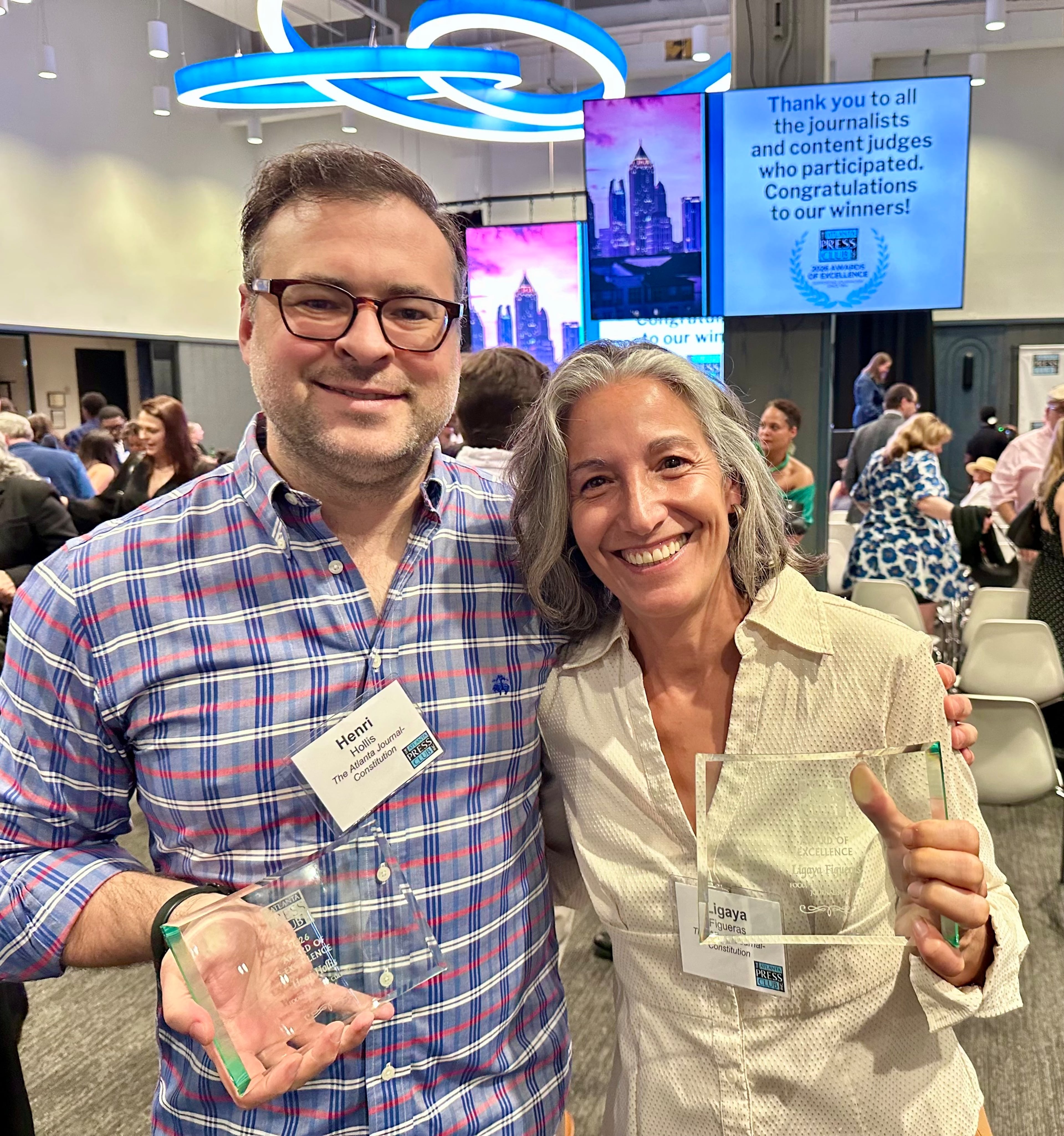 AJC restaurant critic Henri Hollis and former senior food & dining editor Ligaya Figueras show off their Atlanta Press Club Awards of Excellence on May 6, 2026. They received them for their 2025 revamp of the Atlanta 50. (Henri Hollis/AJC)