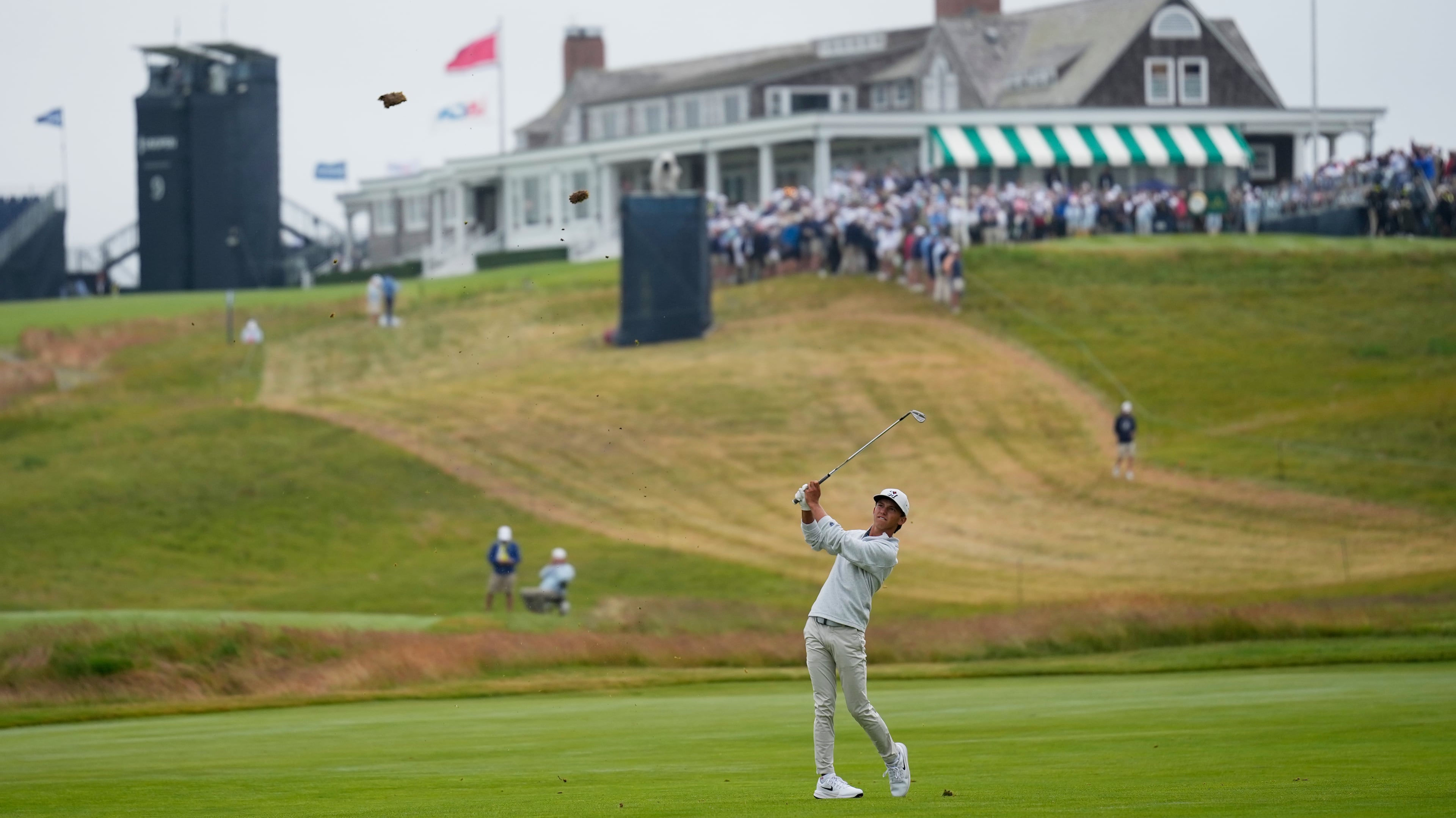Miles Russell hits from the fairway on the first hole during the first round of the U.S. Open golf tournament at Shinnecock Hills Golf Club in Southampton, N.Y., Thursday, June 18, 2026.(AP Photo/David J. Phillip)