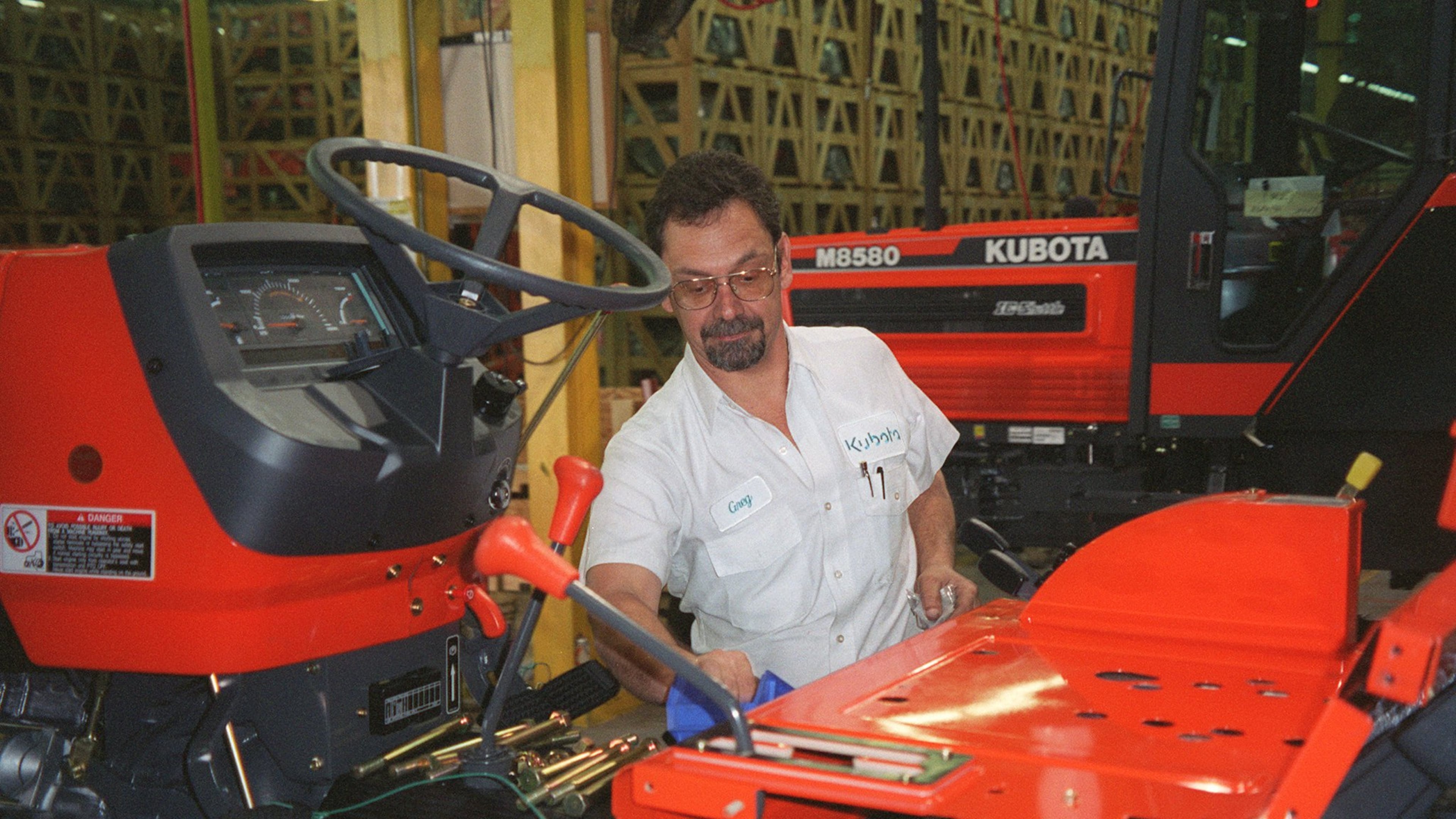 Assembly manager Greg Smith oversees the building a medium-size Kubota tractor. Kubota sent 2.700 employees home Tuesday because of the effects of the coronavirus. (AJC Staff Photo/Peter Kent)