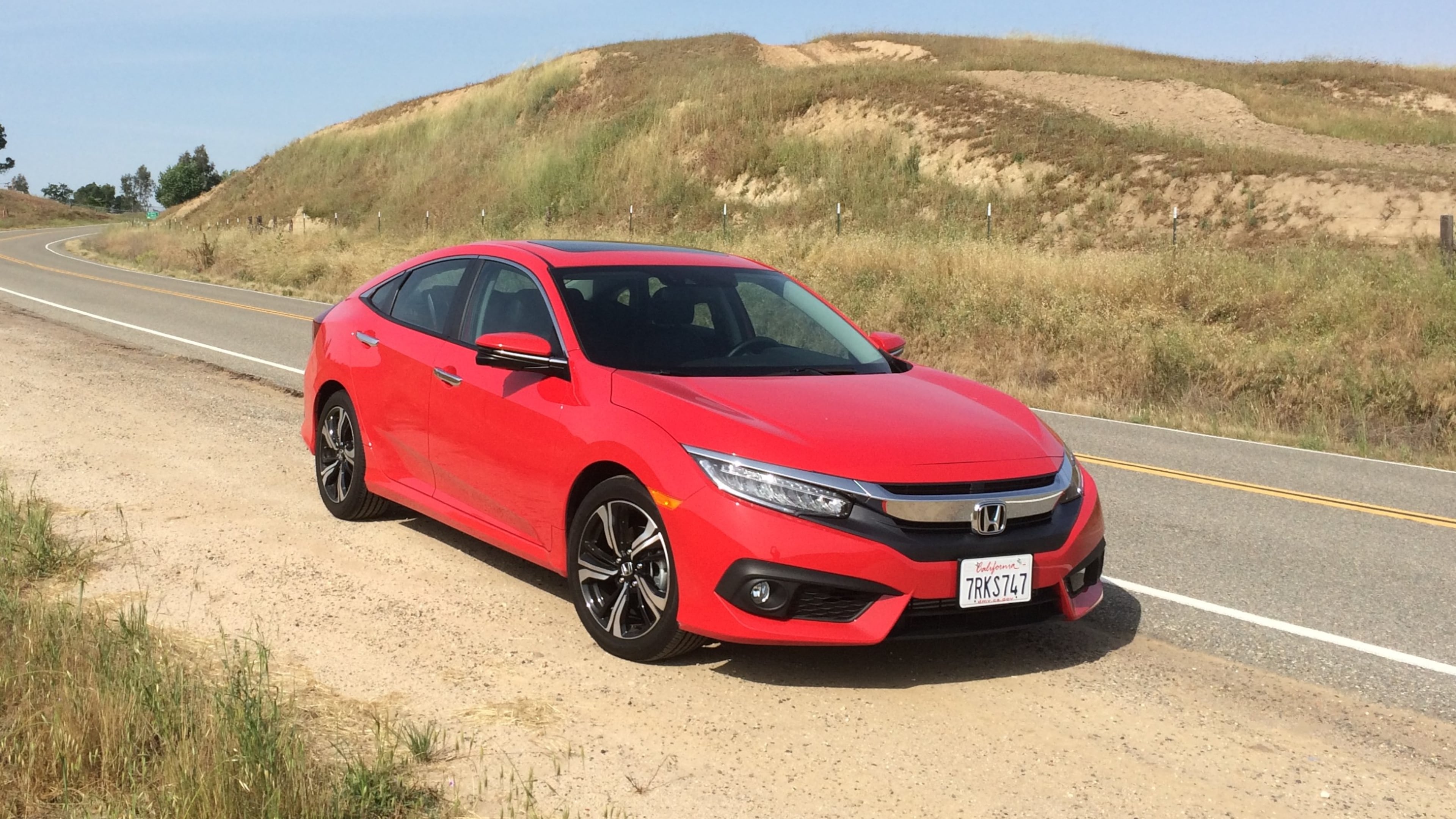 This photo provided by Honda shows the 2016 Civic, a longtime popular choice for a small sedan that offers peppy acceleration and solid fuel economy as well as solid construction. Aim to find a 2016 Civic, the year it received a redesign and a new optional turbocharged engine. (Courtesy of Edmunds via AP)