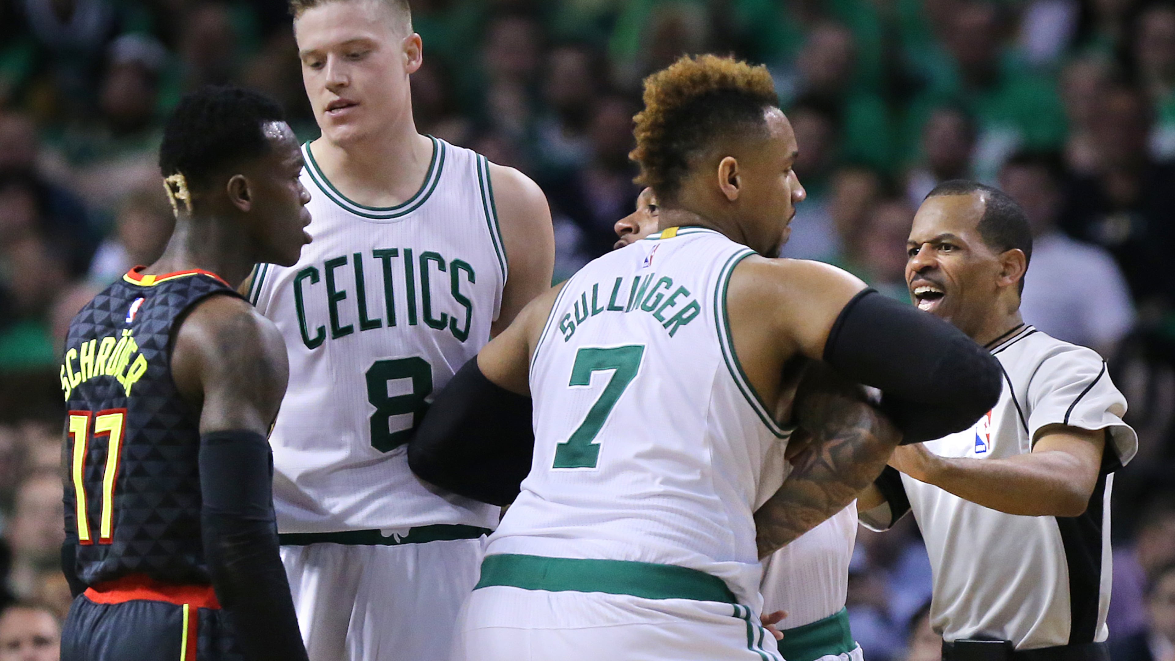 Hawks guard Dennis Schroder and Boston's Isaiah Thomas (being held back by teammate Jonas Jerebko) had to be separated Friday night, when emotions flares after Thomas slapped Schroder. (Curtis Compton/ccompton@ajc.com)
