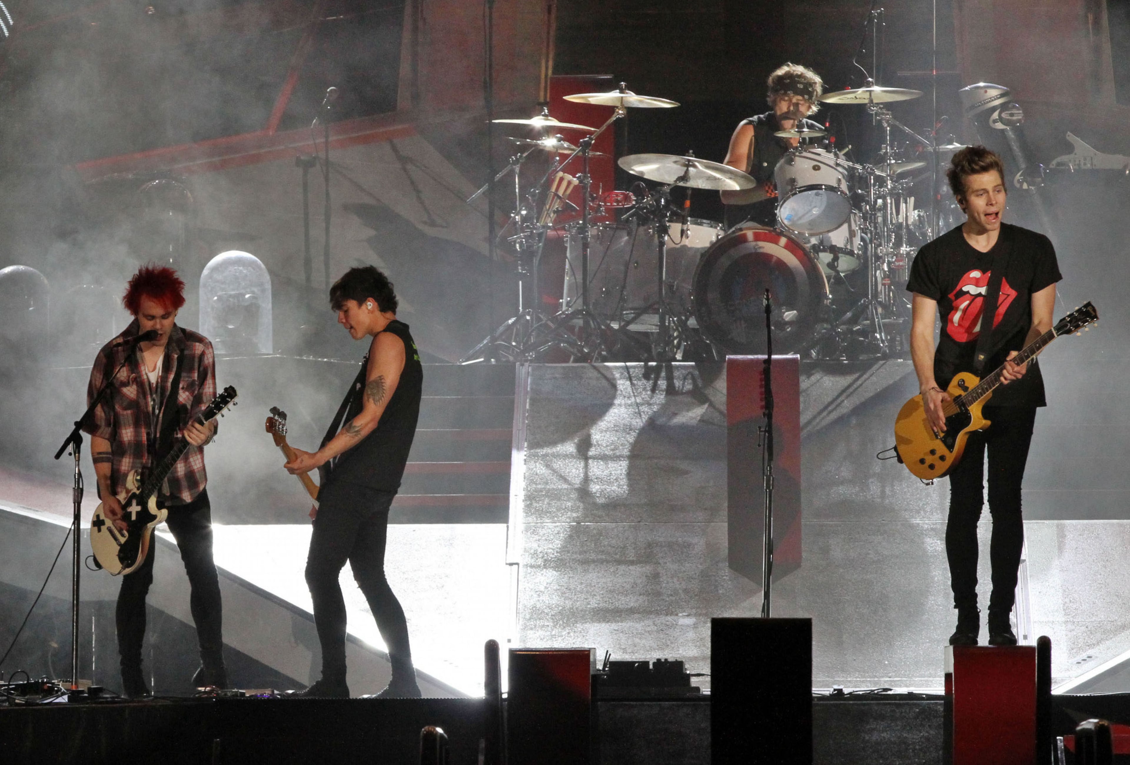 Australian pop band 5 Seconds of Summer performs during their opening set for One Direction Wednesday, October 1, 2014 at the Georgia Dome in Atlanta. Robb D. Cohen/RobbsPhotos.com