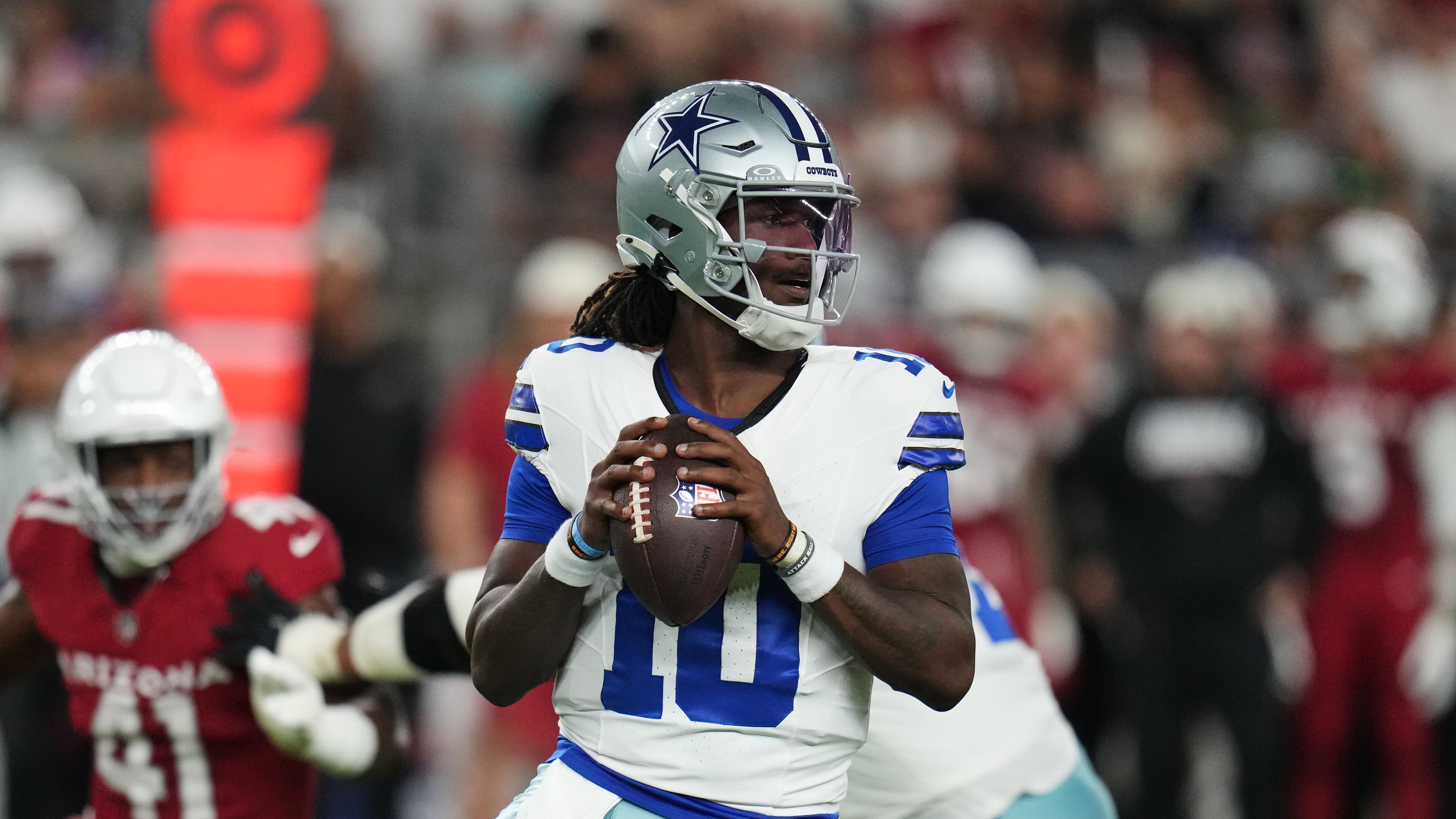 Dallas Cowboys quarterback Joe Milton III (10) drops back to pass in the first half of a preseason NFL football game against the Arizona Cardinals Saturday, Aug. 22, 2026, in Glendale, Ariz. (AP Photo/Rick Scuteri)