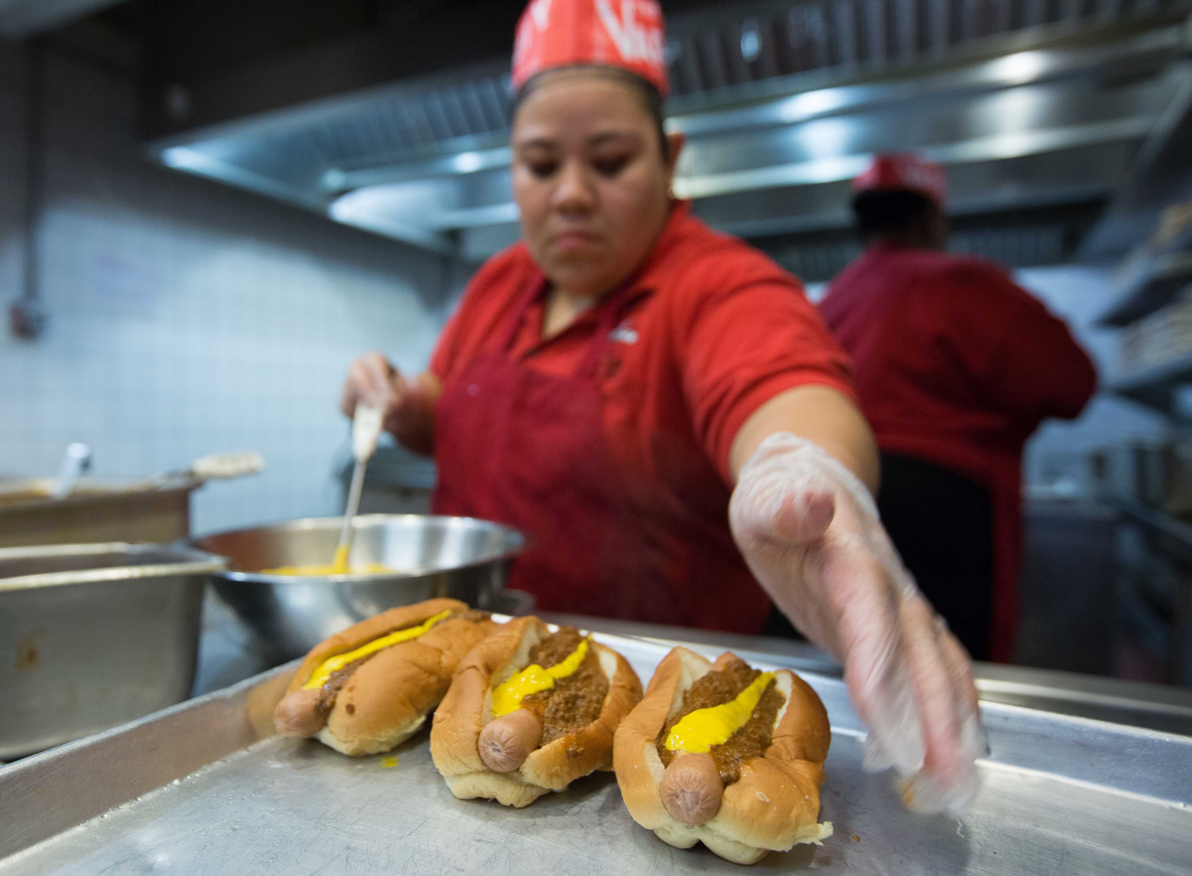 A woman makes chili dogs at The Varsity in downtown Atlanta, Thursday, Feb. 4, 2016. The Alpharetta location of The Varsity closed its doors good this past Monday. BRANDEN CAMP/SPECIAL