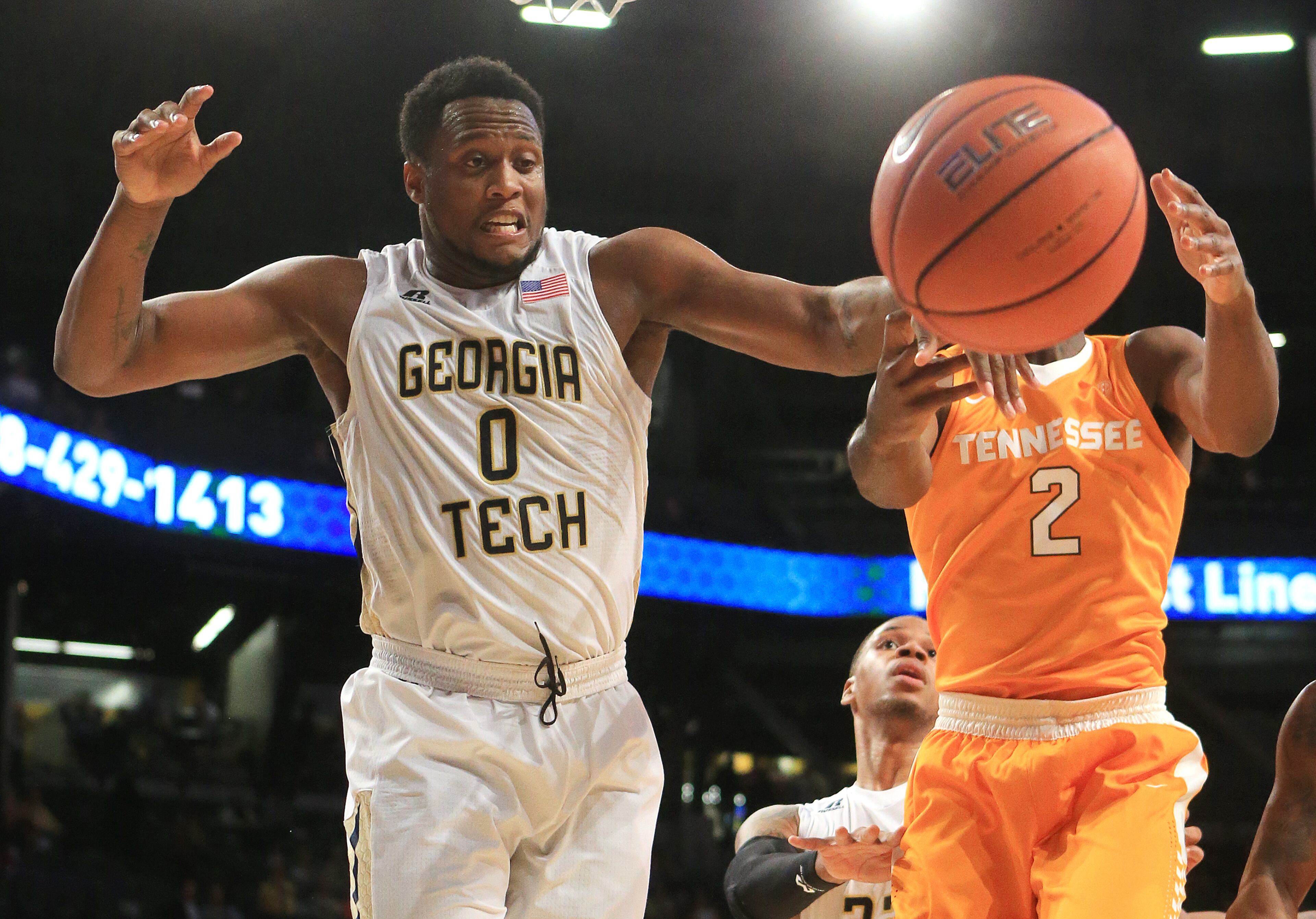 Georgia Tech forward Charles Mitchell knocks the ball away from Tennessee forward Ray Kasongo as he trys to take it to the basket during the first half in a basketball game on Monday, Nov. 16, 2015 in Atlanta. Curtis Compton / ccompton@ajc.com