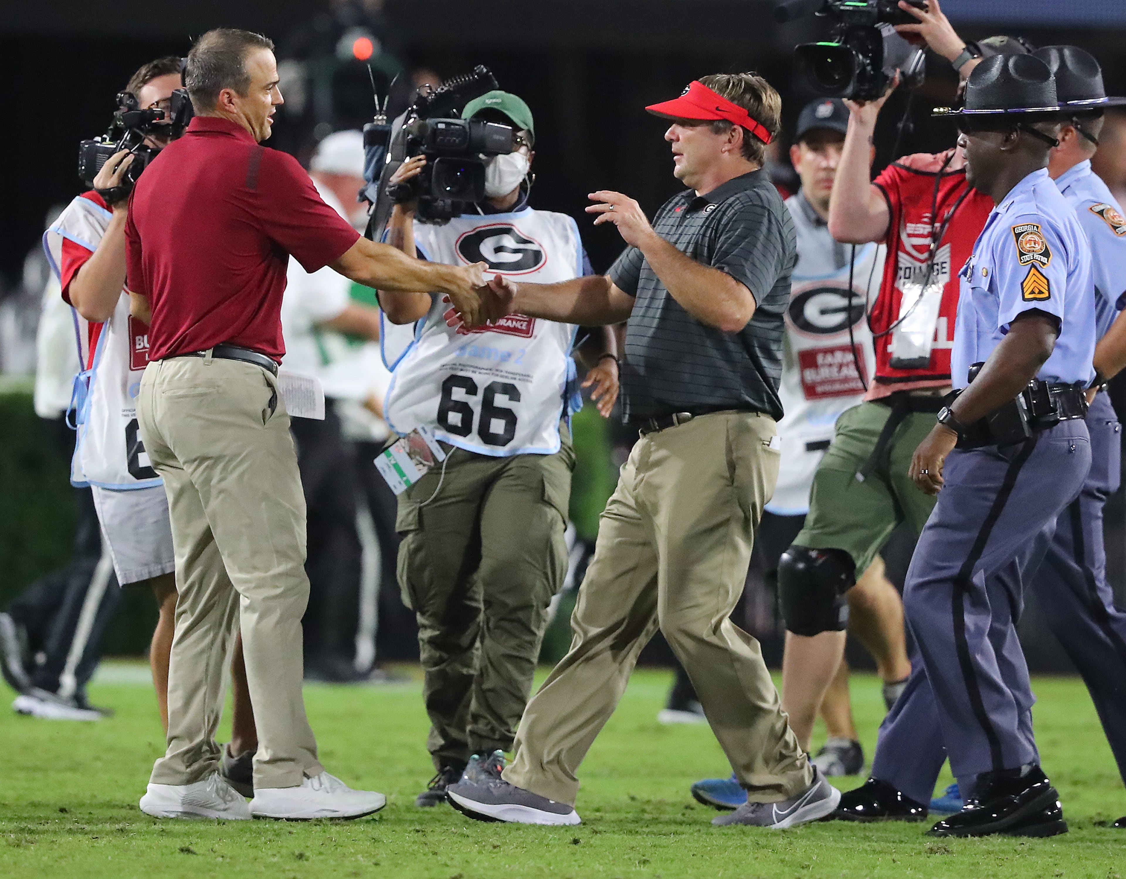 Georgia head coach Kirby Smart (right) shakes hands with South Carolina head coach Shane Beamer after beating South Carolina 40-13 in a NCAA college football game on Saturday, Sept 18, 2021, in Athens. “Curtis Compton / Curtis.Compton@ajc.com”