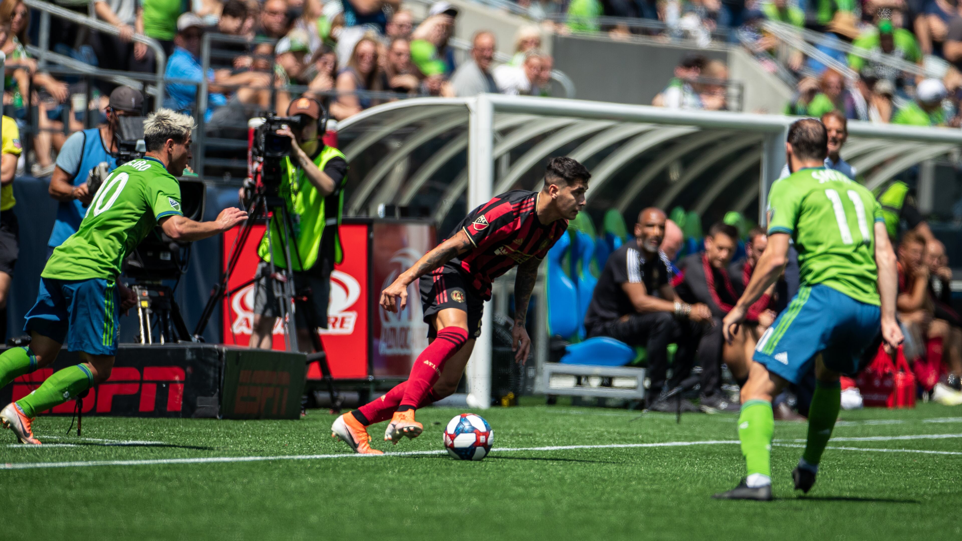 Seattle Sounders defenders converge on Atlanta United during match Sunday, July 14, 2019, at CenturyLink Field in Seattle.