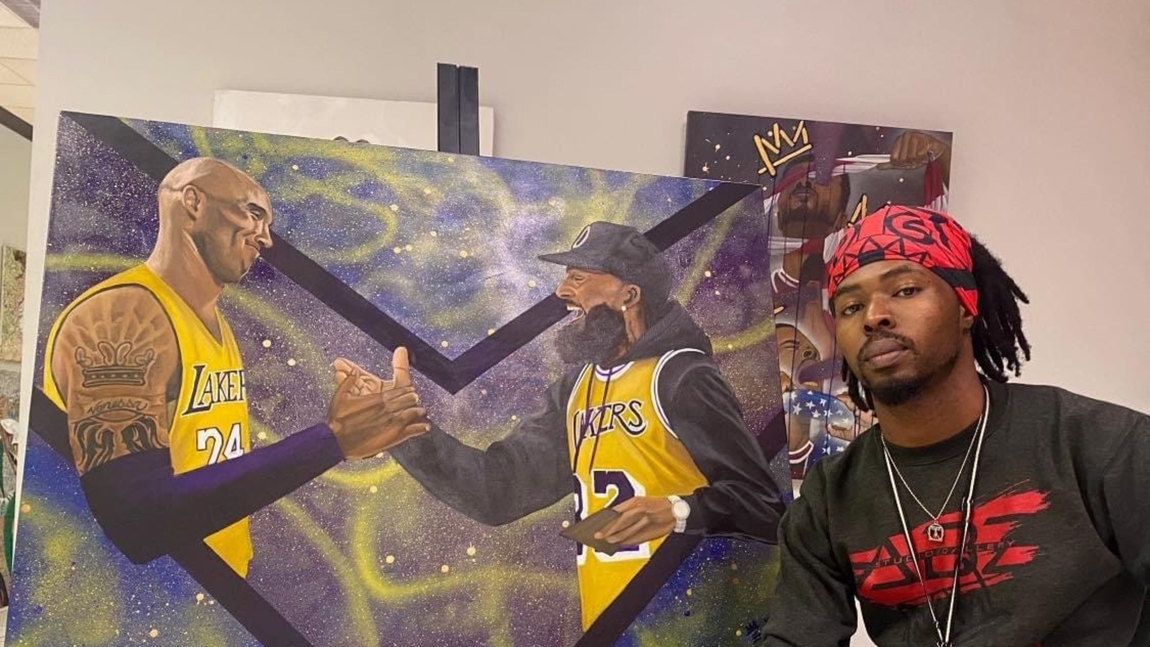 Xavier "Zay" Hutchins with his piece "Marathon Mentality." Photo courtesy of the artist