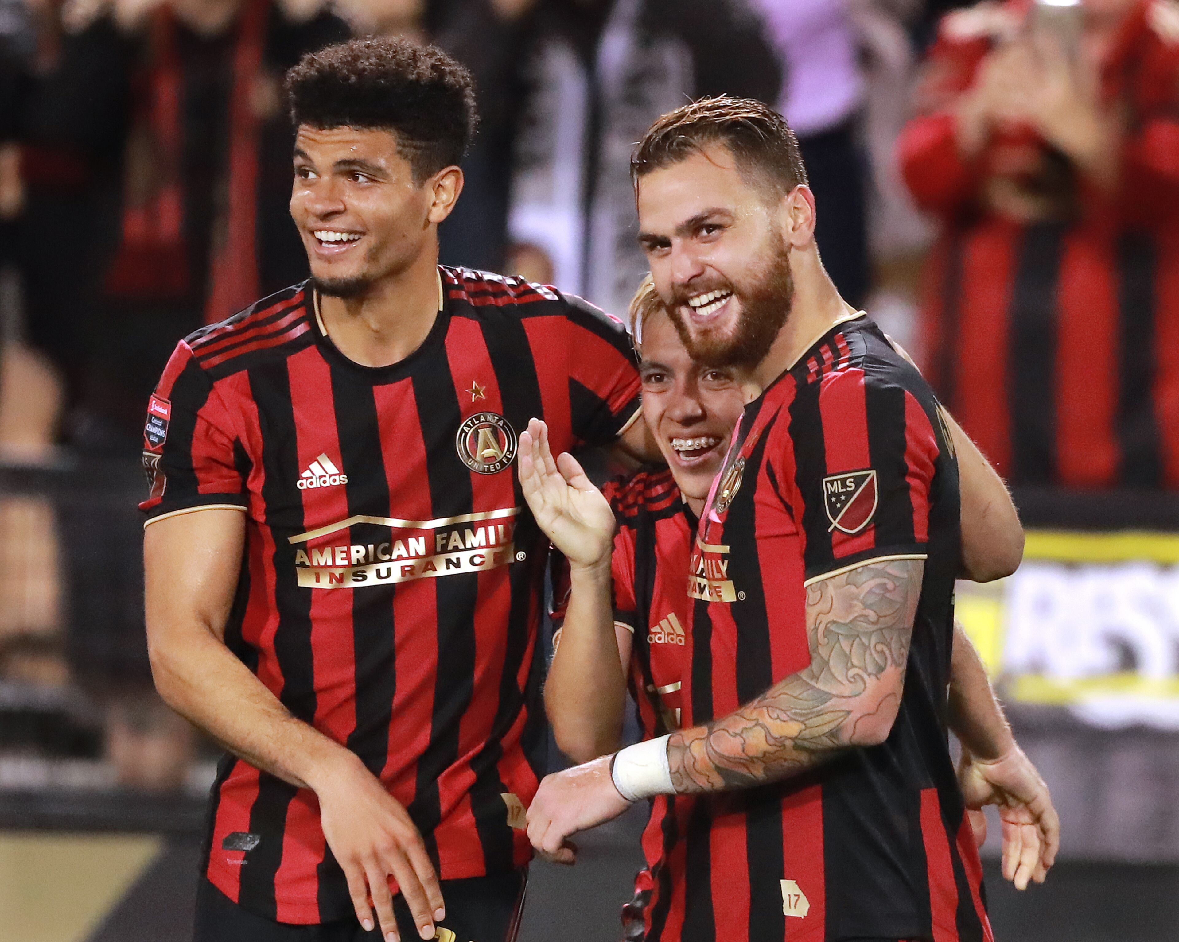 Feb. 28, 2019 Kennesaw: Atlanta United midfielder Leandro Gonzalez Pirez (right) celebrates his goal with Esequiel Barco (center), who had the assist, and Miles Robinson for a 4-0 victory over C.S. Herediano in their Concacaf Champions League soccer match on Thursday, Feb. 28, 2019, in Kennesaw. Curtis Compton/ccompton@ajc.com
