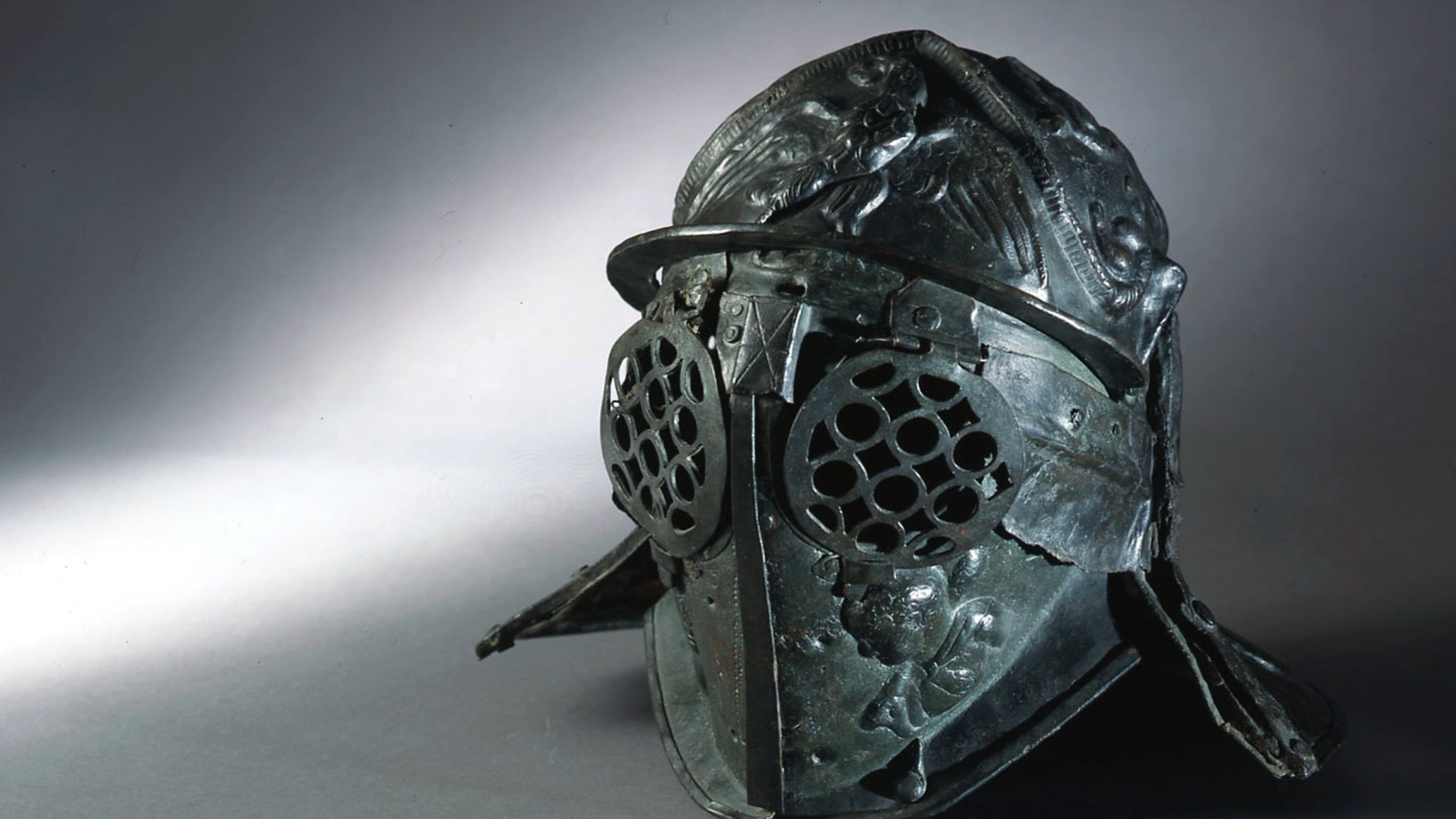 This bronze first century helmet of a gladiator from the barracks of Pompeii is part of the new traveling exhibition “Gladiators: Heroes of the Colosseum” at the Fernbank Museum of Natural History through Jan. 7. CONTRIBUTED BY: Museo Archeologico Nazionale