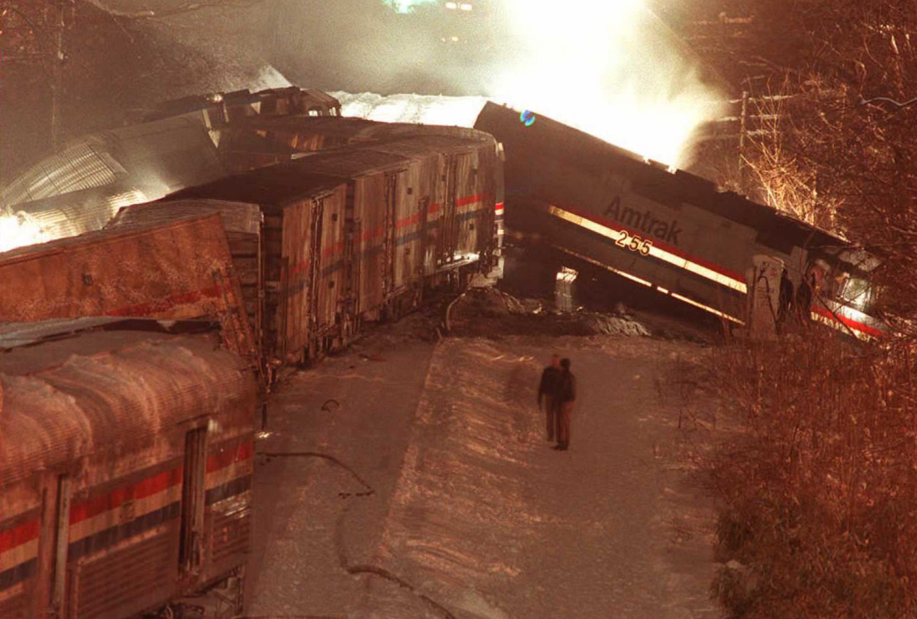 1996 - Maryland train collision in Silver Spring, Maryland. There were 26 injured and 11 deaths. - SILVER SPRING, MD - FEBRUARY 16: Cars from an Amtrak train lie off the tracks 16 February in Silver Spring, MD after a collision between an Amtrak train and a Marc commuter train. Six people are reported killed and 14 injured in the accident that happened just north of Washington, DC. (Photo credit should read CHUCK KENNEDY/AFP/Getty Images)