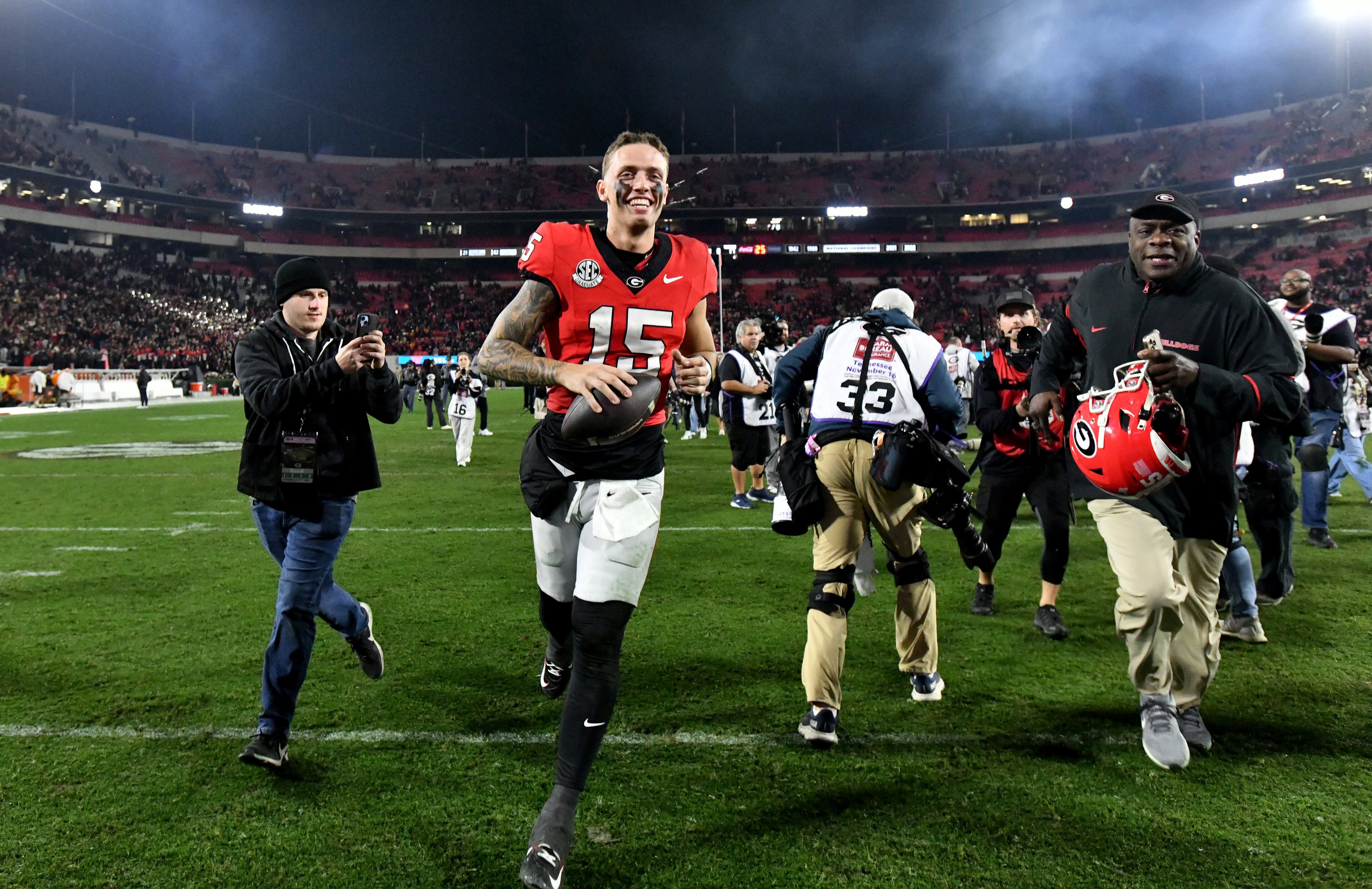 Georgia quarterback Carson Beck (15) leaves the football field after Georgia beat Tennessee in an NCAA football game at Sanford Stadium, Saturday, November 16, 2024, in Athens. Georgia won 31-17 over Tennessee. (Hyosub Shin / AJC)