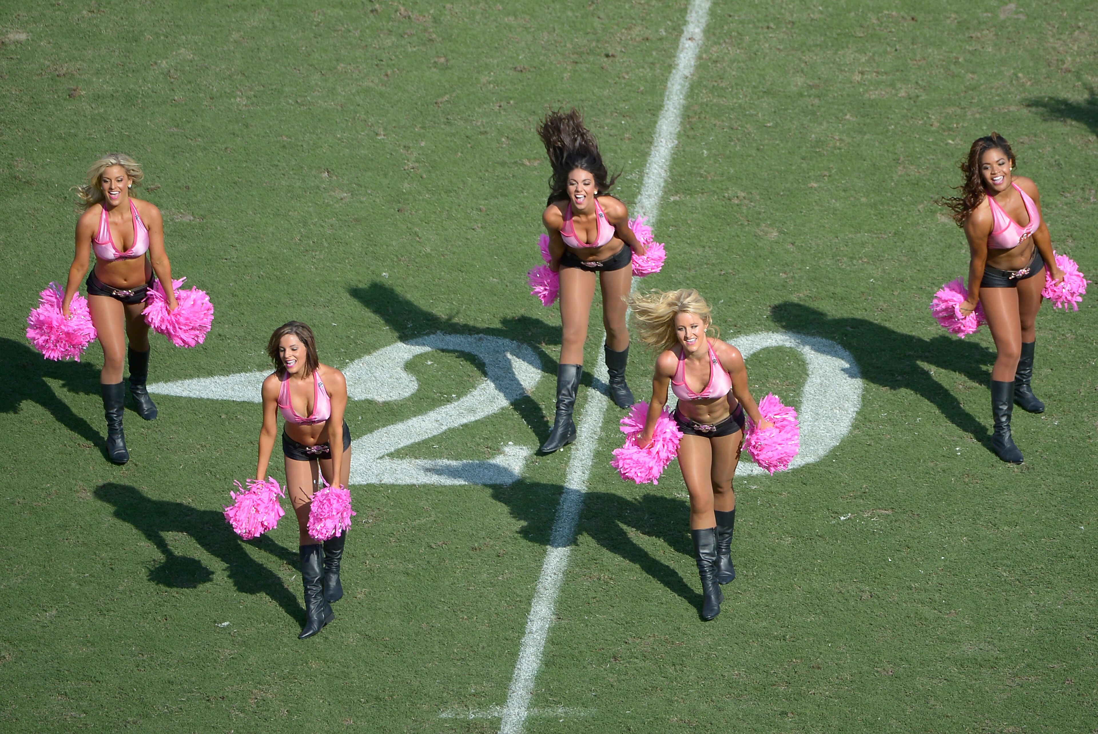 The Tampa Bay Buccaneers cheerleaders perform during the second half of an NFL football game against the Philadelphia Eagles in Tampa, Fla., Sunday, Oct. 13, 2013.(AP Photo/Phelan M. Ebenhack)