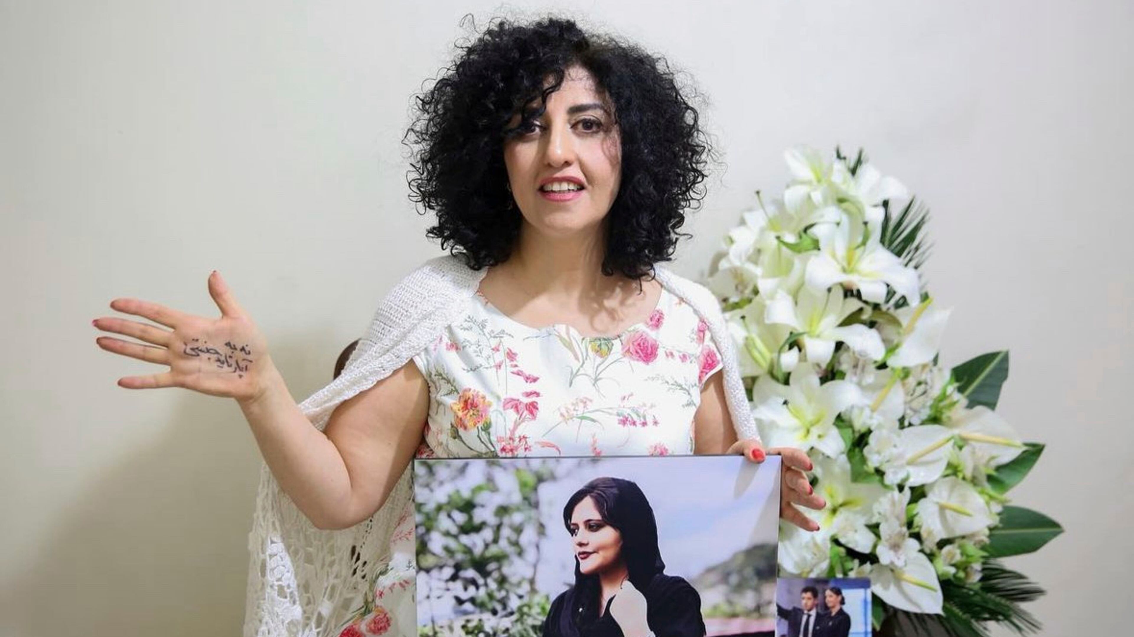 FILE - In this photo released by the Narges Foundation Archive, Nobel Peace Prize laureate Narges Mohammad is seen after being released on a medical furlough in Tehran, Iran, Wednesday, Dec. 4, 2024. On her hand written in Farsi is "End gender apartheid." (Narges Foundation Archive via AP, File)