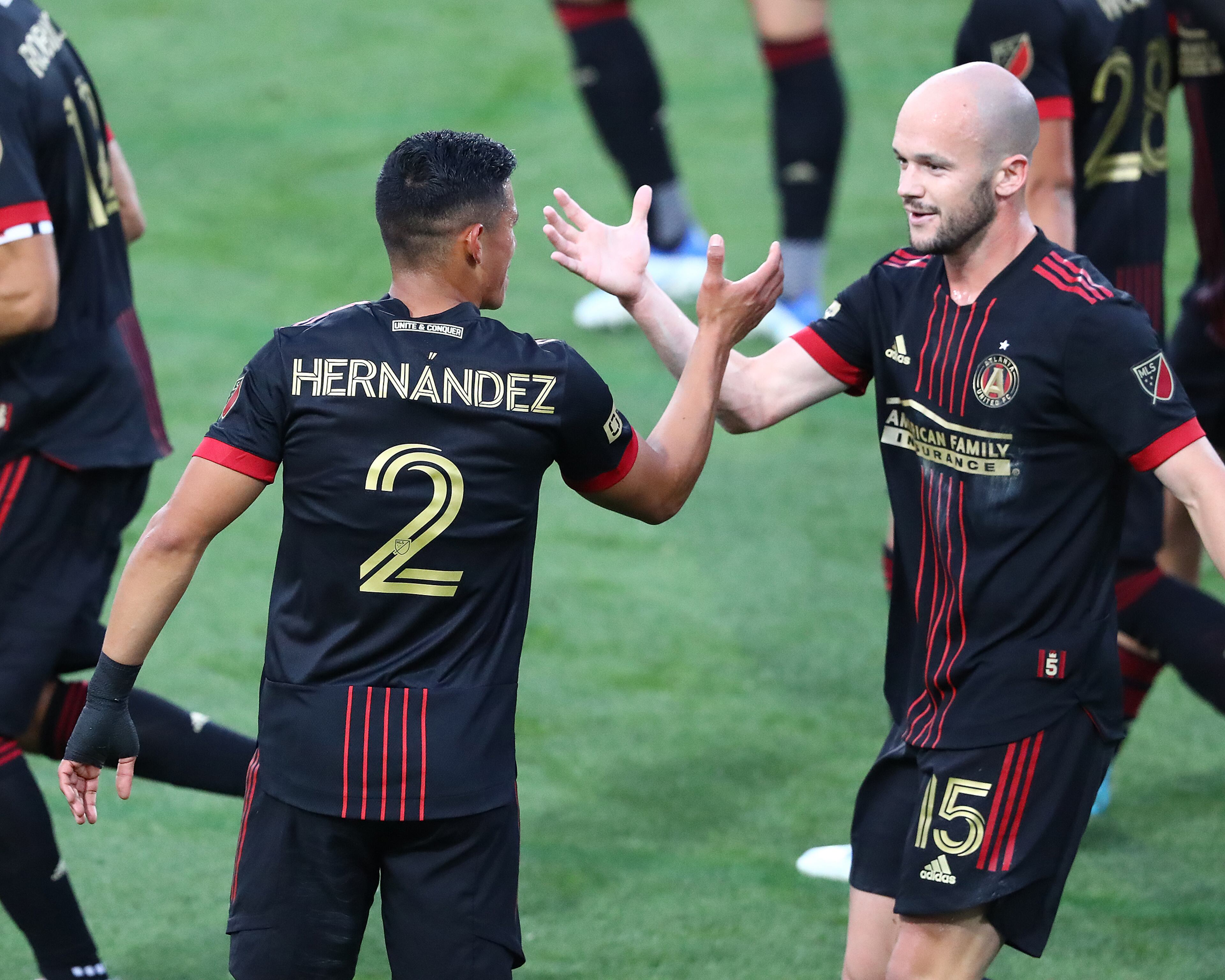 Atlanta United defender Ronald Hernandez (left) gets five from defender Andrew Gutman (right), after scoring his goal against Chattanooga FC with the assist from Gutman to take a 1-0 lead in the Lamar Hunt U.S. Open Cup on Wednesday, April 20, 2022, in Kennesaw. “Curtis Compton / Curtis.Compton@ajc.com”