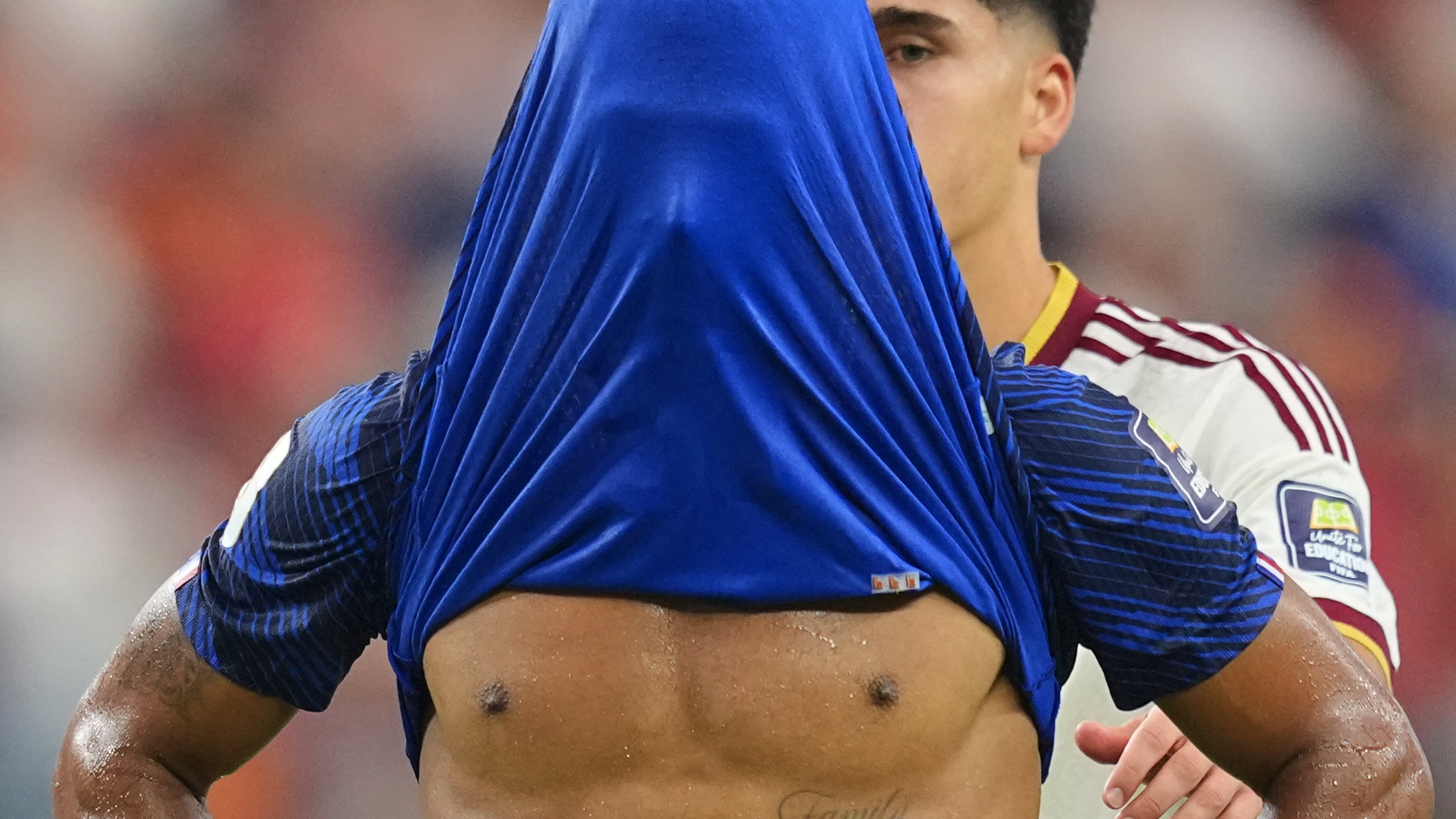 France's Desire Doue covers his face after his side's lost against in a World Cup semifinal soccer match in Arlington, Texas, near Dallas, Tuesday, July 14, 2026. (AP Photo/Julio Cortez)