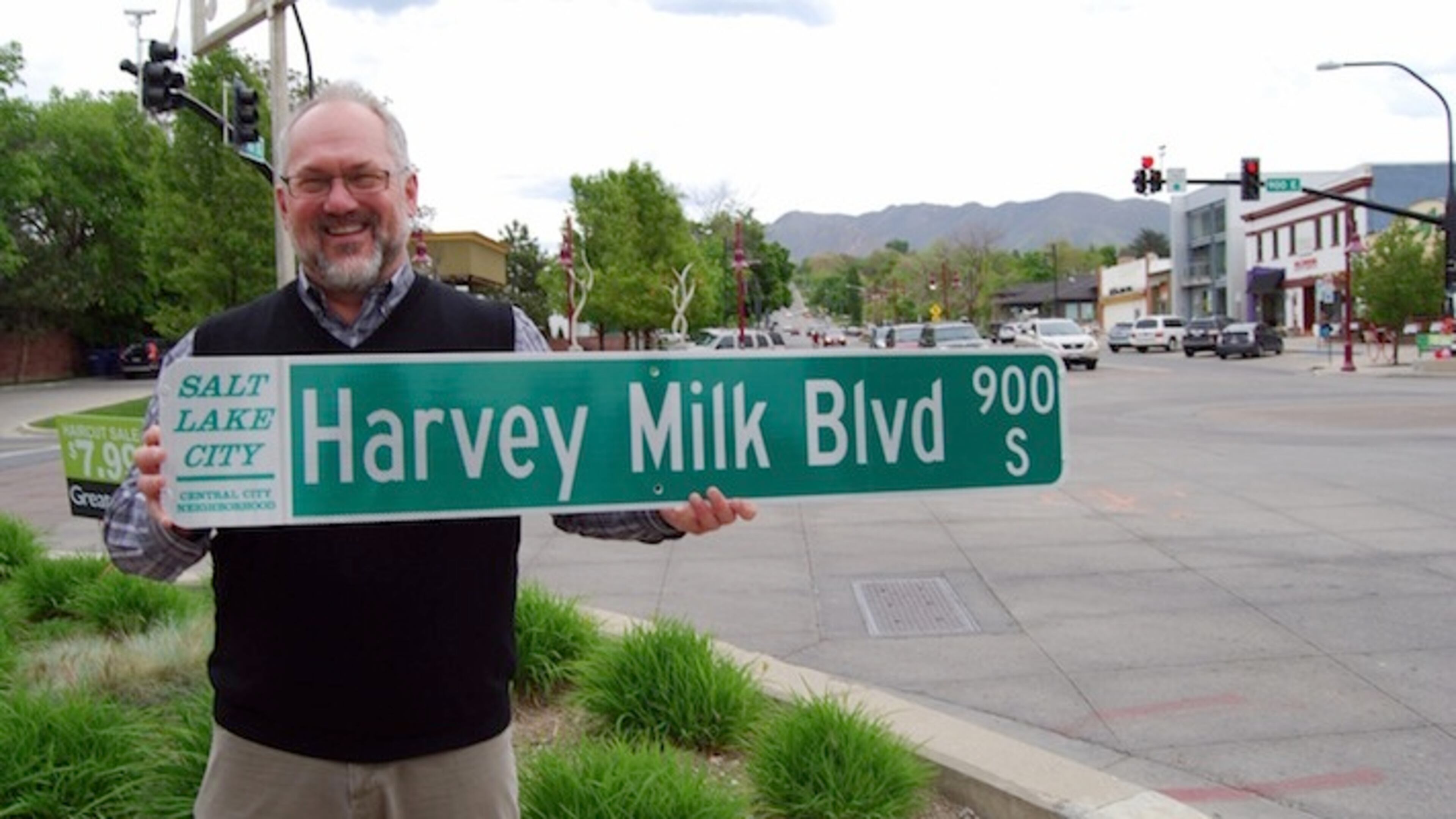 Openly gay Salt Lake City councilman Stan Penfold at 9th & 9th, heart of the city's gay community, with one of the new street signs. (Dan Weist/Salt Lake City Council)