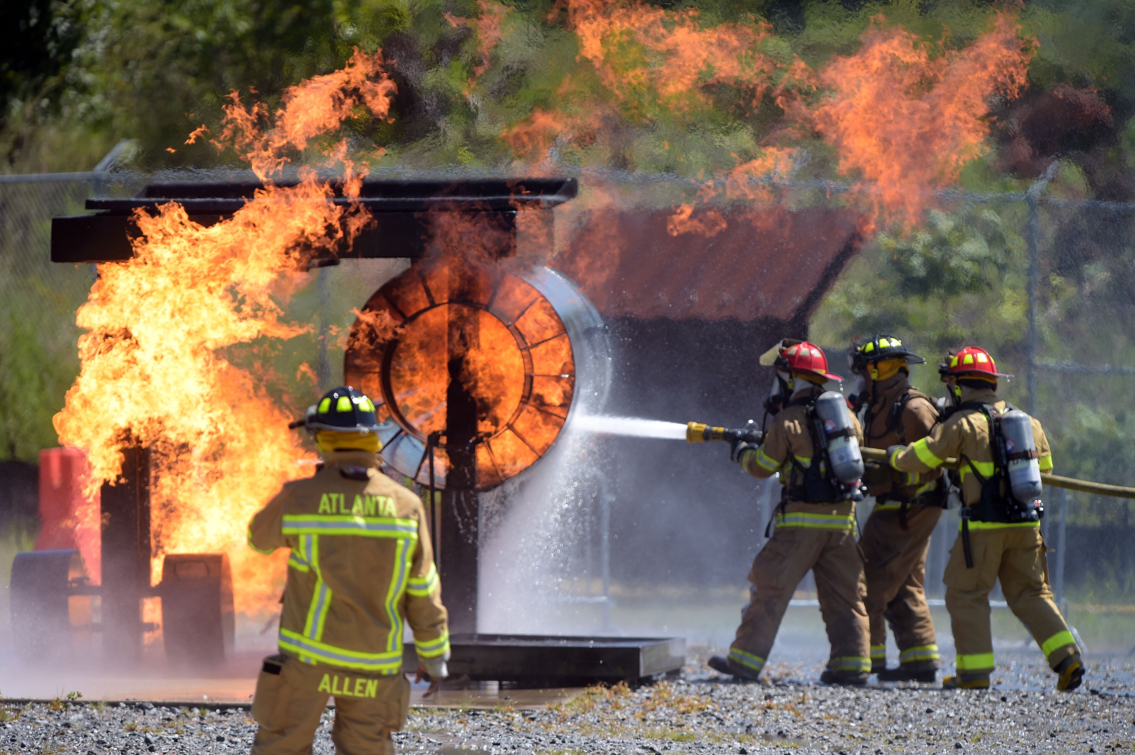 SEPTEMBER 14, 2015 ATLANTA Atlanta Fire Rescue Department firefighters hosted live fire training for attendees at the Aircraft Rescue Fire Fighting (ARFF) Conference, Monday, September, 14, 2015. Firefighters from across the world, battled a simulated fire in an engine and landing gear and also a cascade fire with wing and fuel tanks. Firefighters were Atlanta this week for the 26th Annual ARFF Working Group Conference and Educational Symposium. One of the highlights of the conference was the live fire training at the Hartsfield-Jackson firefighter training site. KENT D. JOHNSON/KDJOHNSON@AJC.COM