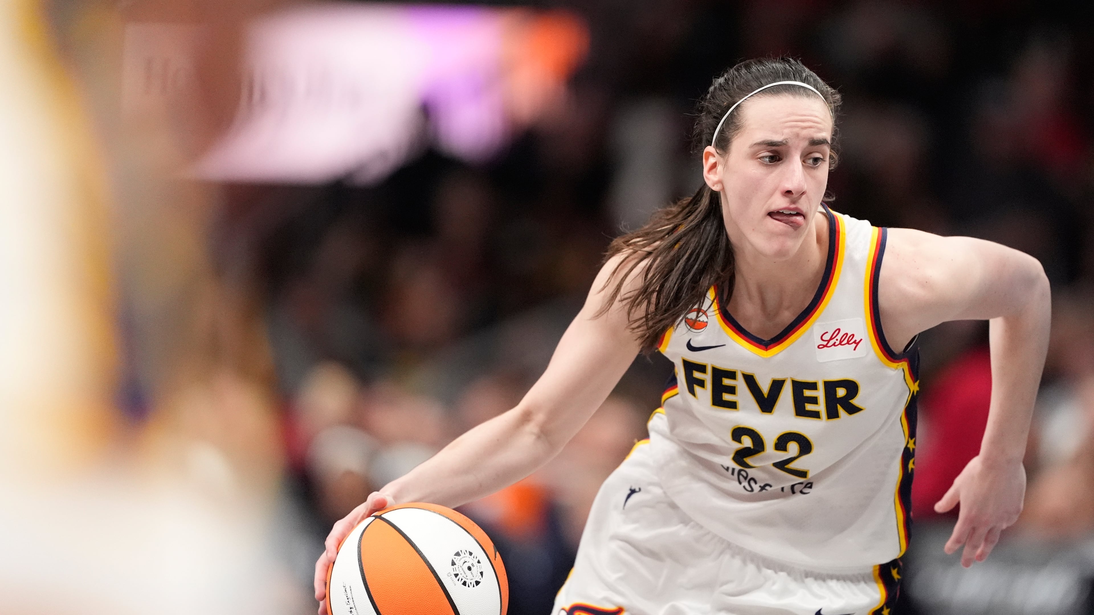 Indiana Fever guard Caitlin Clark (22) dribbles the ball in the second half of an WNBA basketball game against the Atlanta Dream Sunday, Aug. 16, 2026, in Atlanta. (AP Photo/Brynn Anderson)