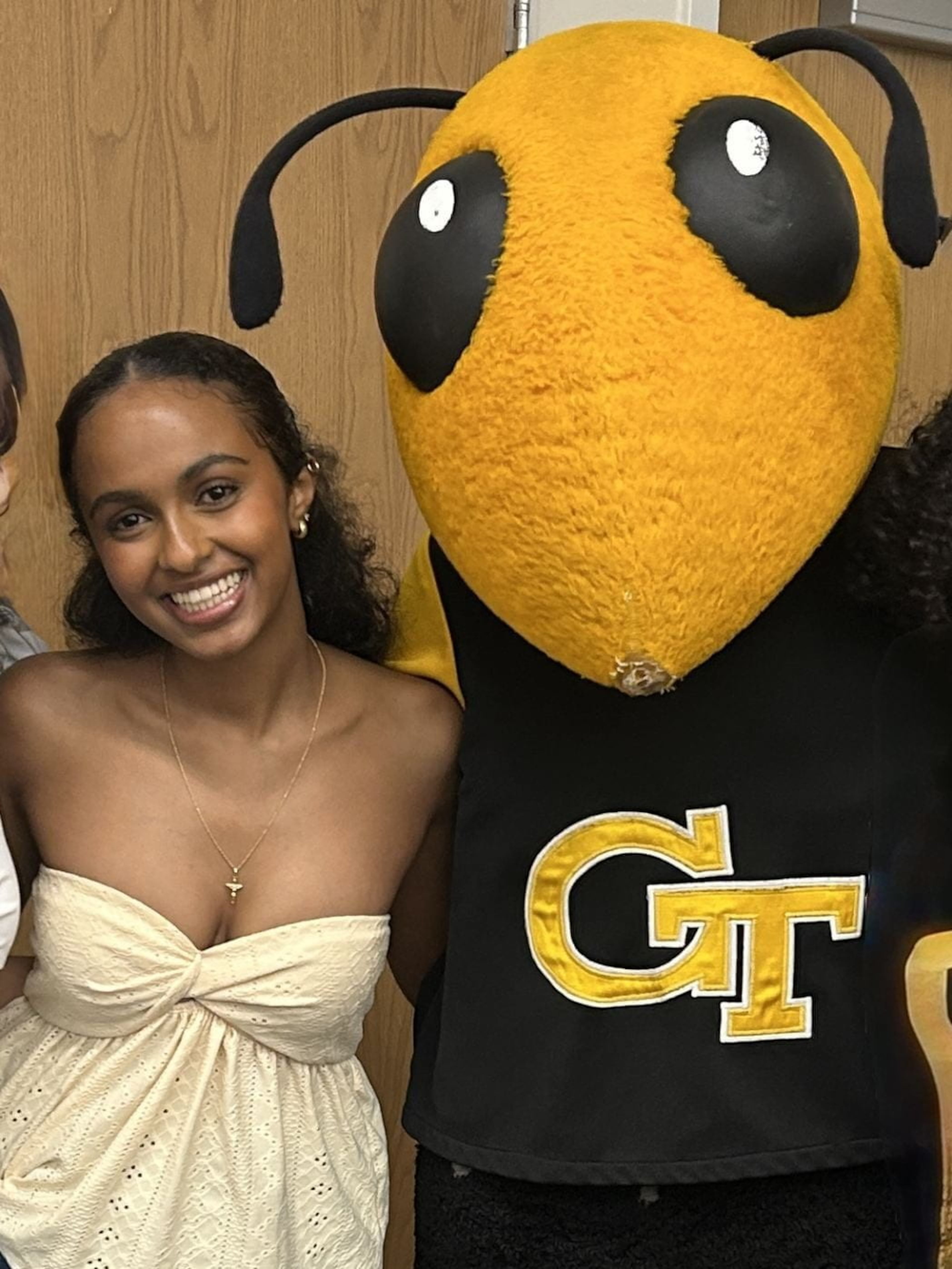 Rakeb Tesfassellasie, a third-year student at Georgia Tech, poses with the university's mascot, Buzz. (Courtesy of Georgia Tech)