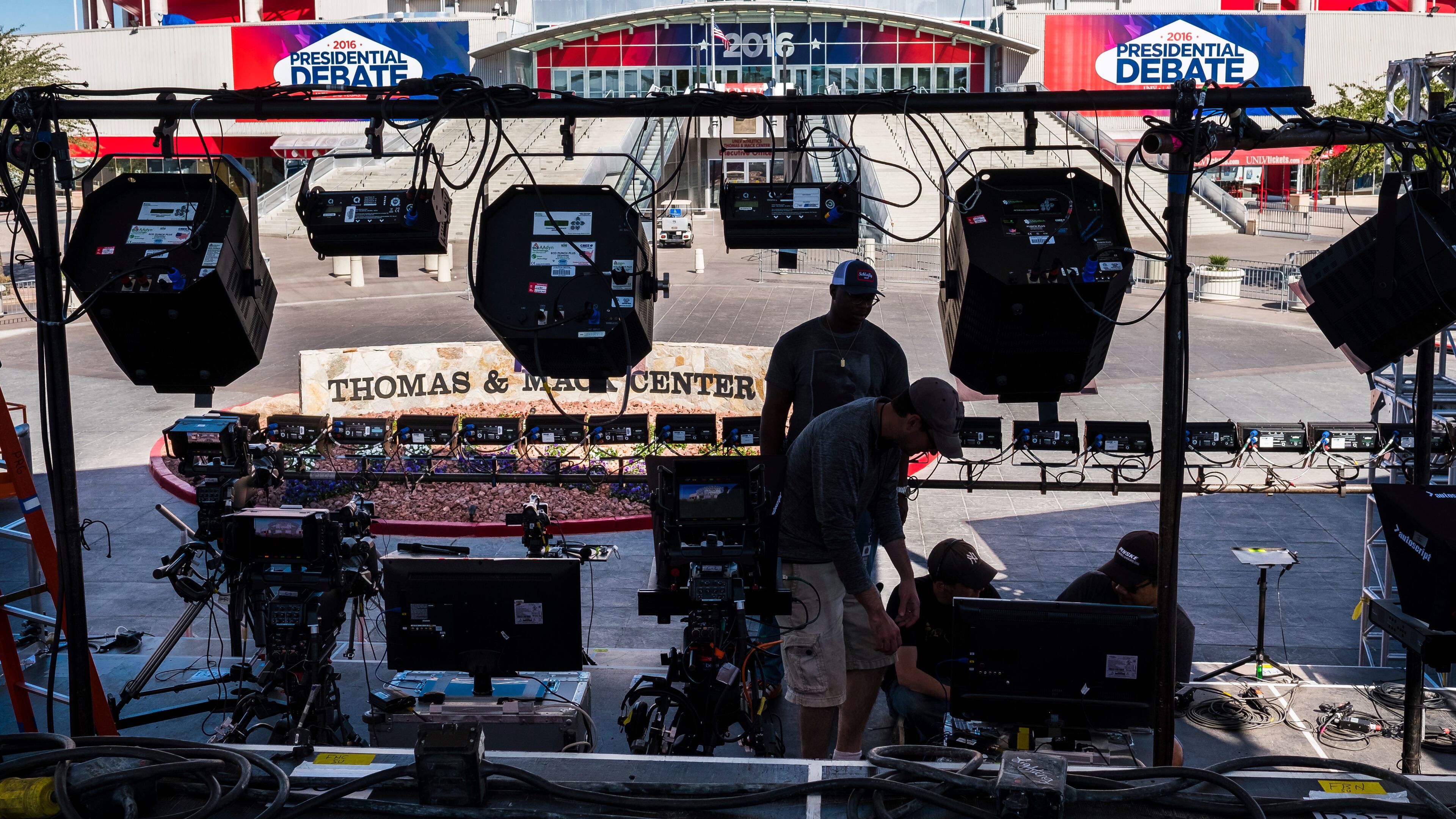 Television crews set up outside of the presidential debate site Monday Oct. 17, 2016 at the University of Nevada, Las Vegas in Las Vegas as preparation continue for the final debate between Democratic presidential nominee Hillary Clinton and Republican presidential nominee Donald Trump. (AP Photo/J. David Ake)