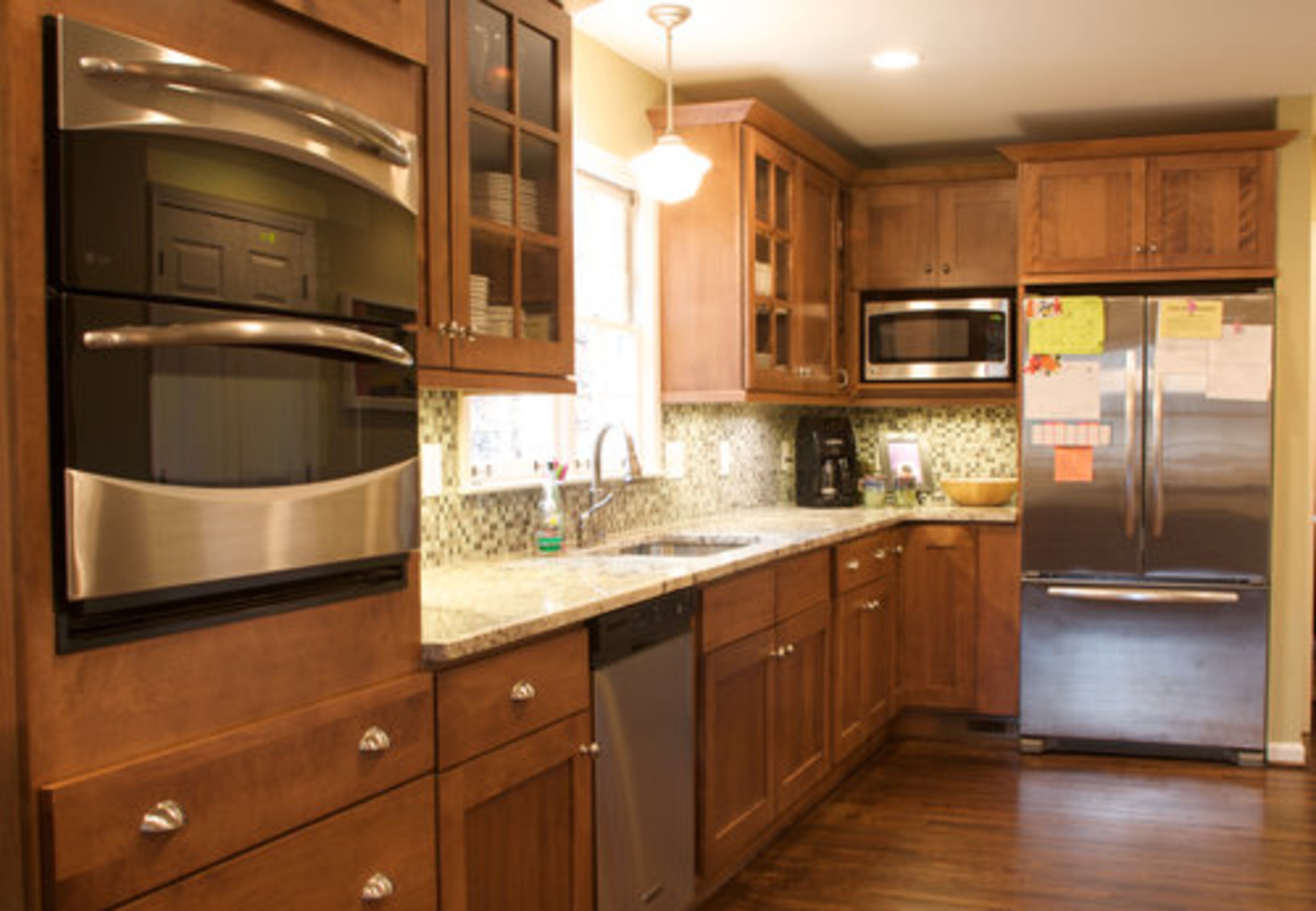 During the 2010 remodel of the Shevlin's home, new maple cabinets, granite countertops and wood floors were added to the larger kitchen.