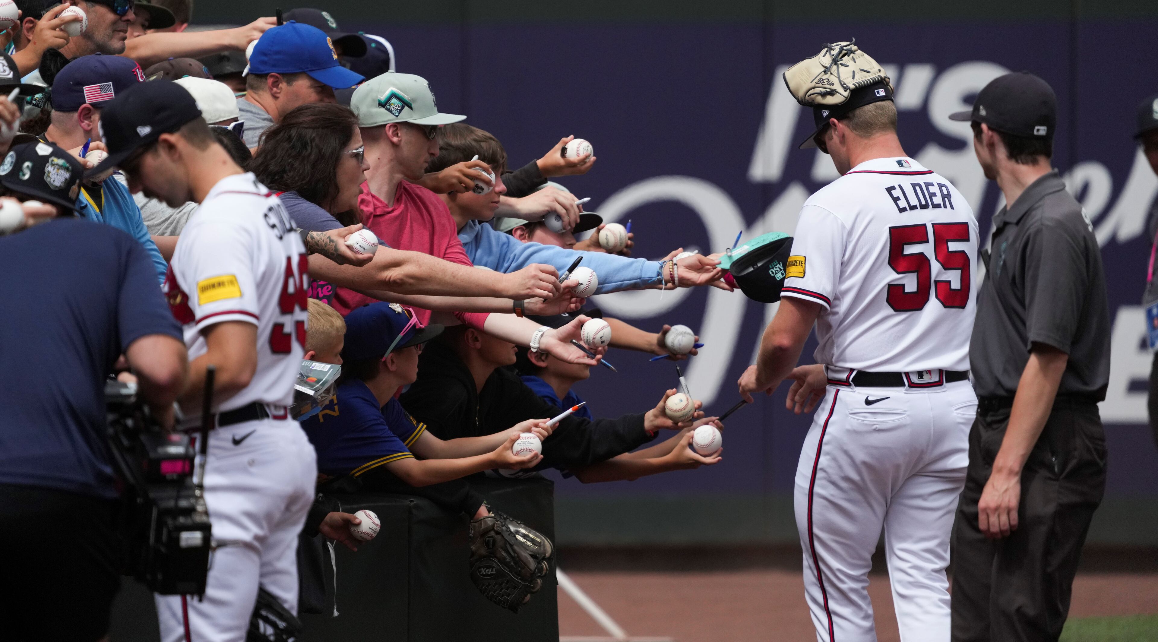 Hanging with the fans: Bryce Elder and Spencer Strider (left) sign autographs during batting practice before the MLB All-Star baseball Home Run Derby in Seattle, Monday, July 10, 2023. (AP Photo/Ted Warren)