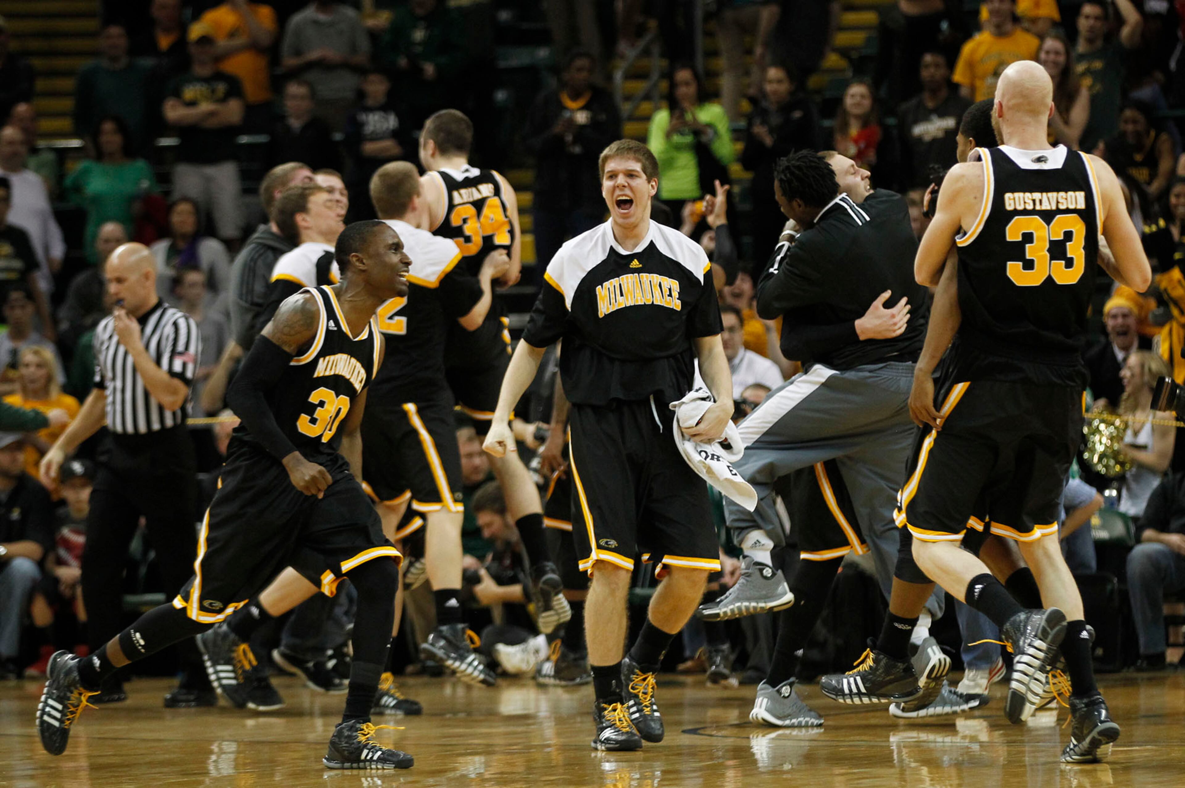 Milwaukee Panthers react as the clock ran out to defeat the Wright State Raiders 69-63 for the Horizon League Championship. TY GREENLEES / STAFF